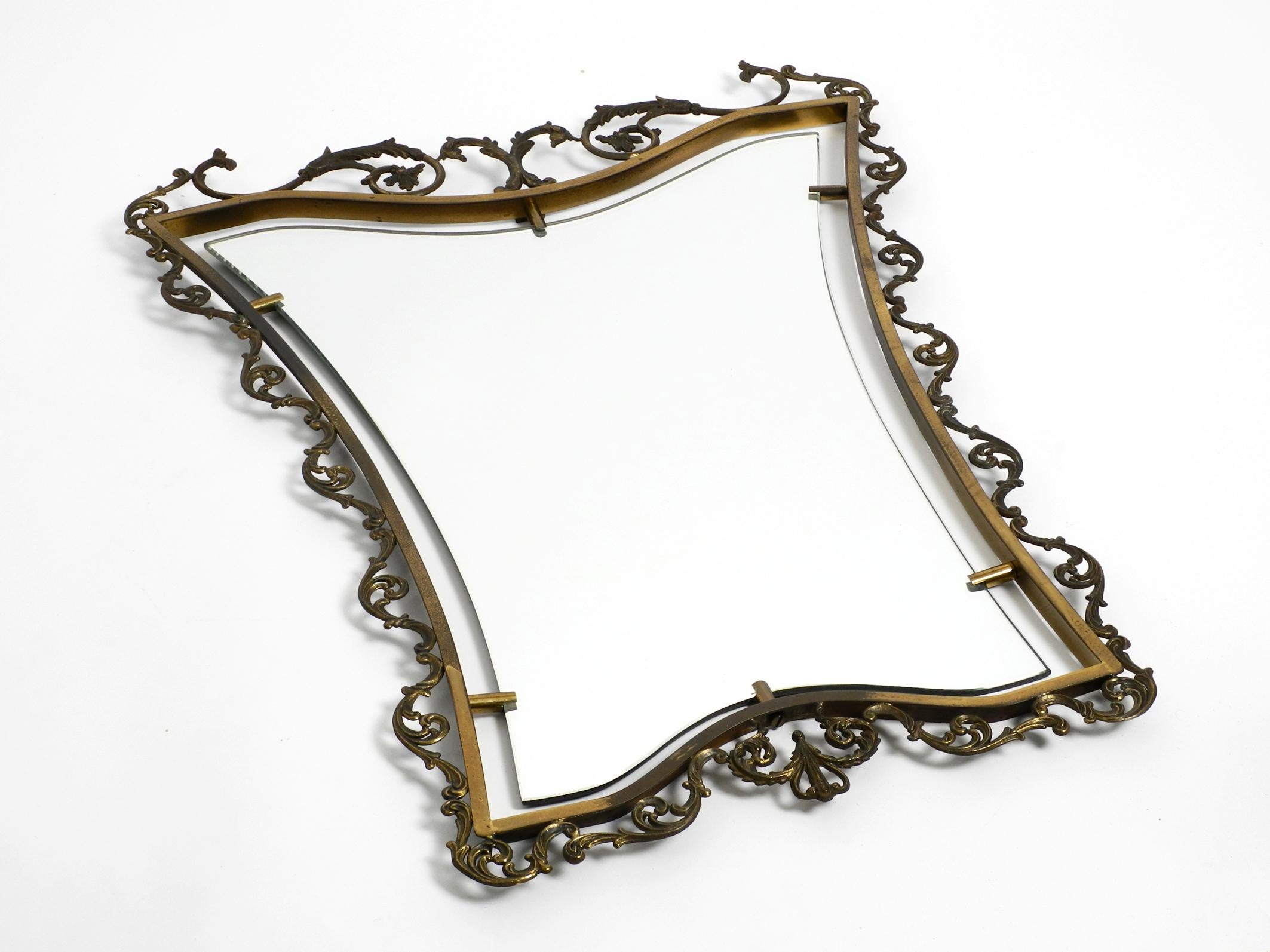 Mid-Century Modern Extraordinary Large, Heavy Italian Mid Century Wall Mirror with an Ornate Brass For Sale