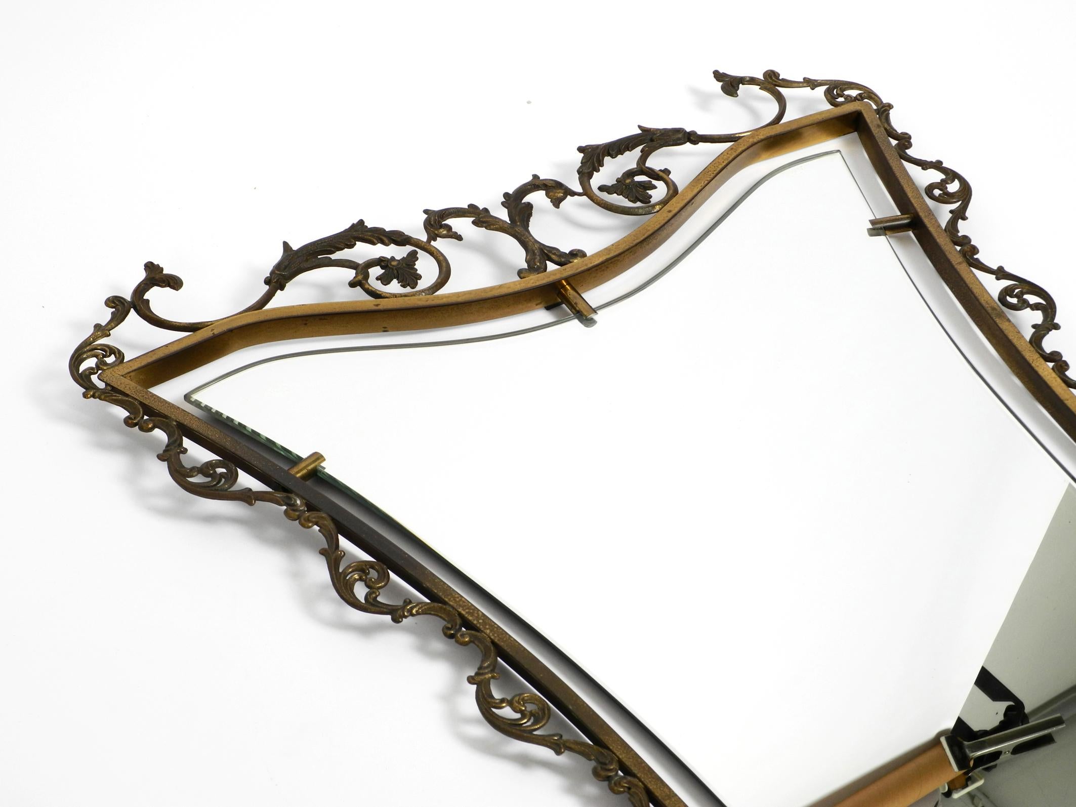 Mid-20th Century Extraordinary Large, Heavy Italian Mid Century Wall Mirror with an Ornate Brass For Sale