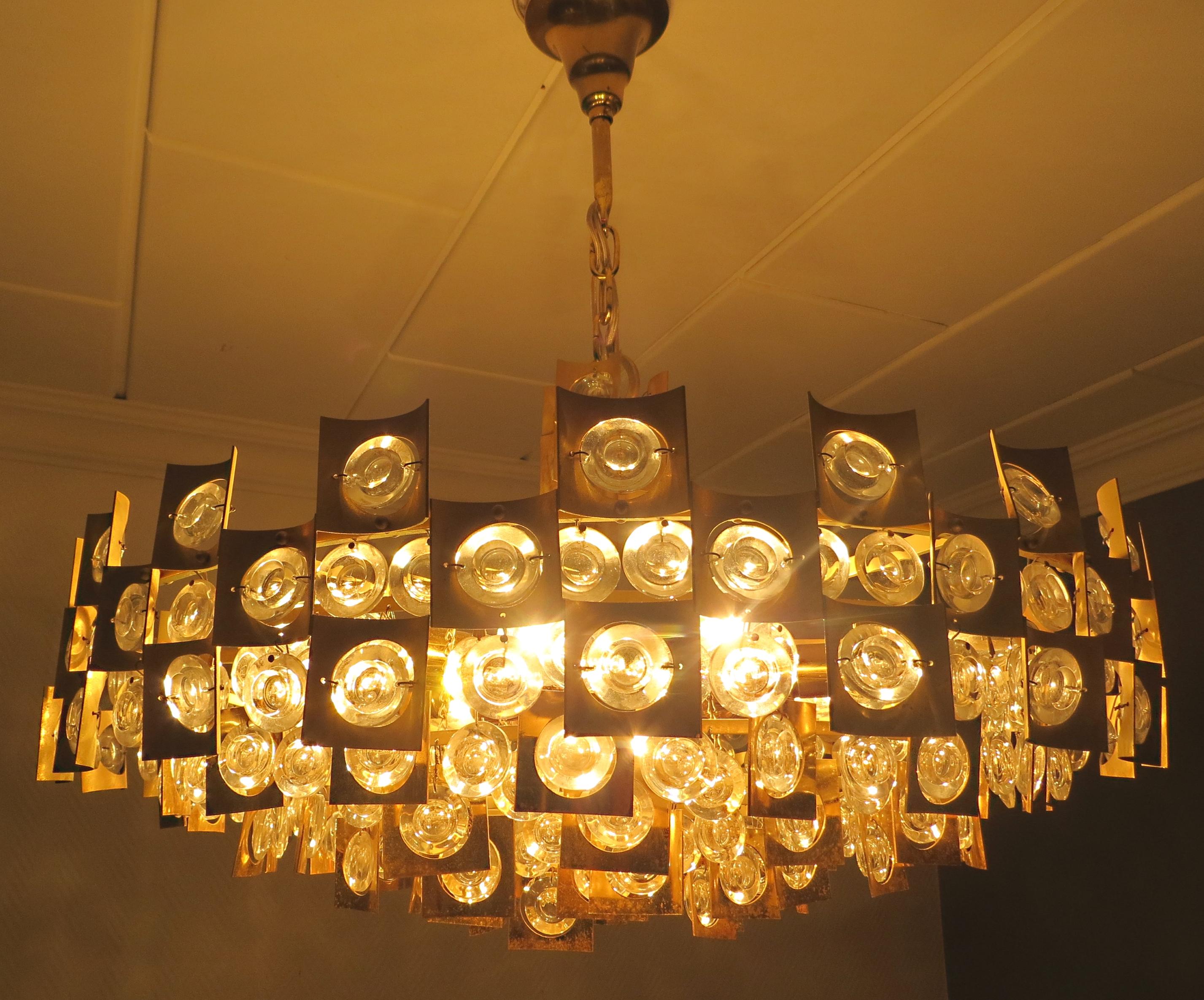 A very representative, luxury, modern and unique midcentury vintage chandelier with a oversize diameter of 23 inches,
attributed by Palwa (Germany), can be purchased here. The quality is from high class and comparable to Bakalowits & Sohne,