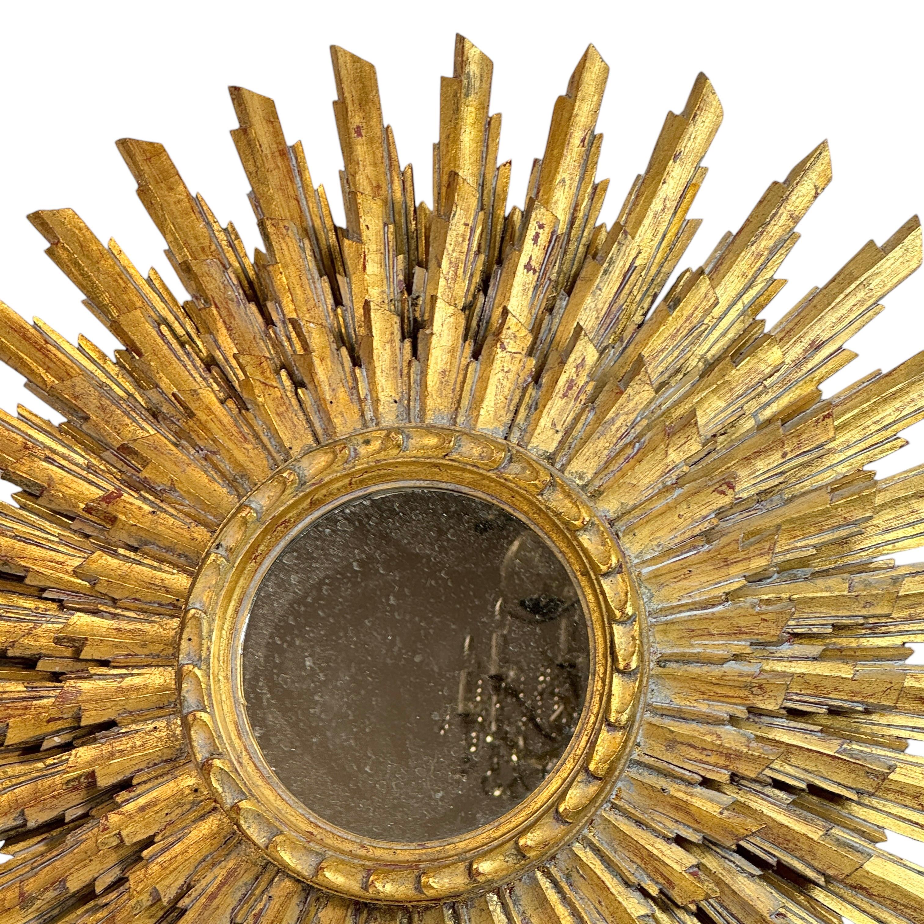 Miroir Extraordinaire grand miroir en trois couches Sunburst Starburst  Bois doré France 1950 en vente
