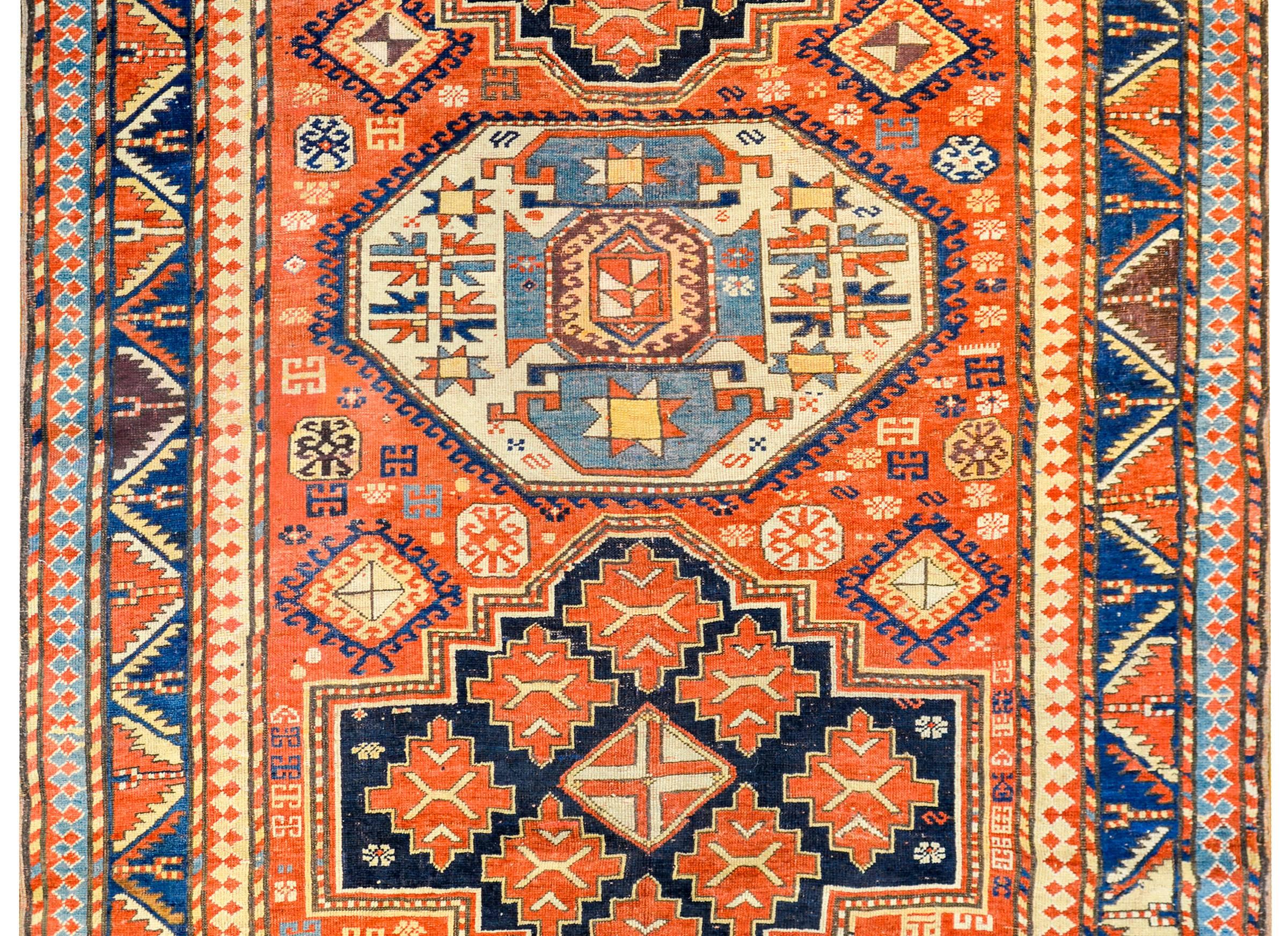 An extraordinary late 19th century Lori Pambak, South Caucasus rug with a fantastically woven pattern consisting of two large diamond shaped medallions, and one central hexagonal medallion, each woven with beautiful large-scale stylized flowers