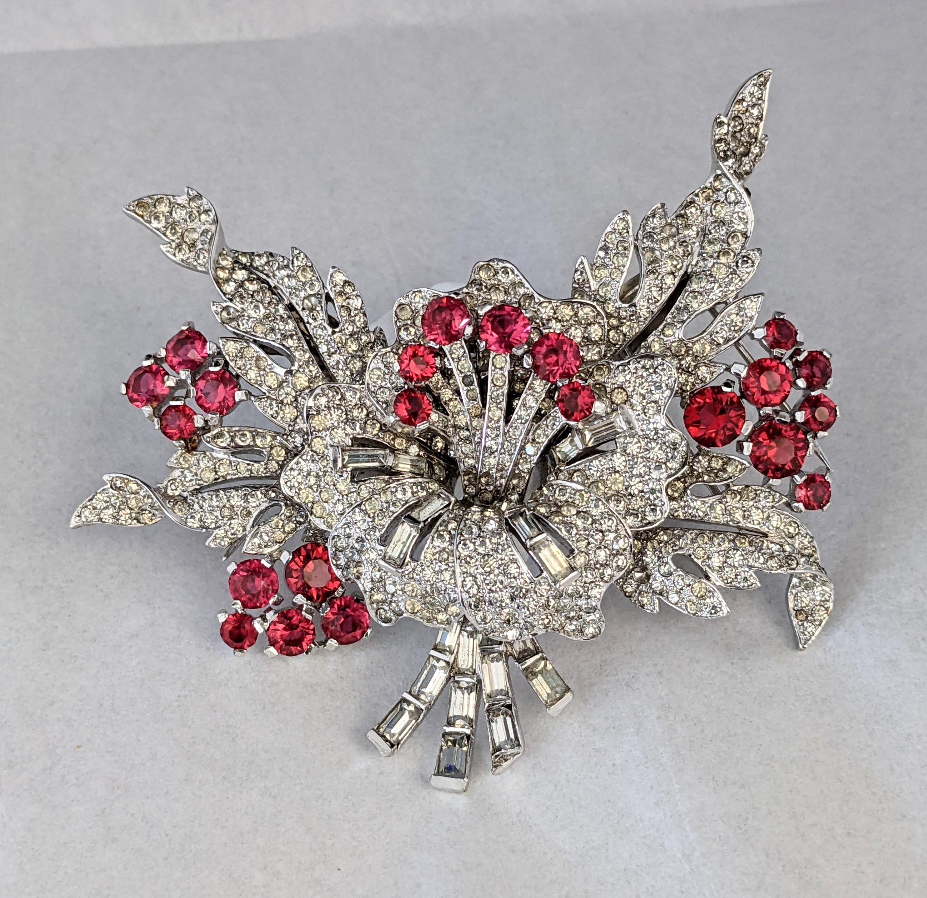 Amazing Early Marcel Boucher Flower Corsage Clip Brooch from the early 1930's. Massive scale and Collector Quality. Designed to be worn at neckline or within a deep V neckline. 
The 2 side pave leaf panels are hinged for light movement. 4