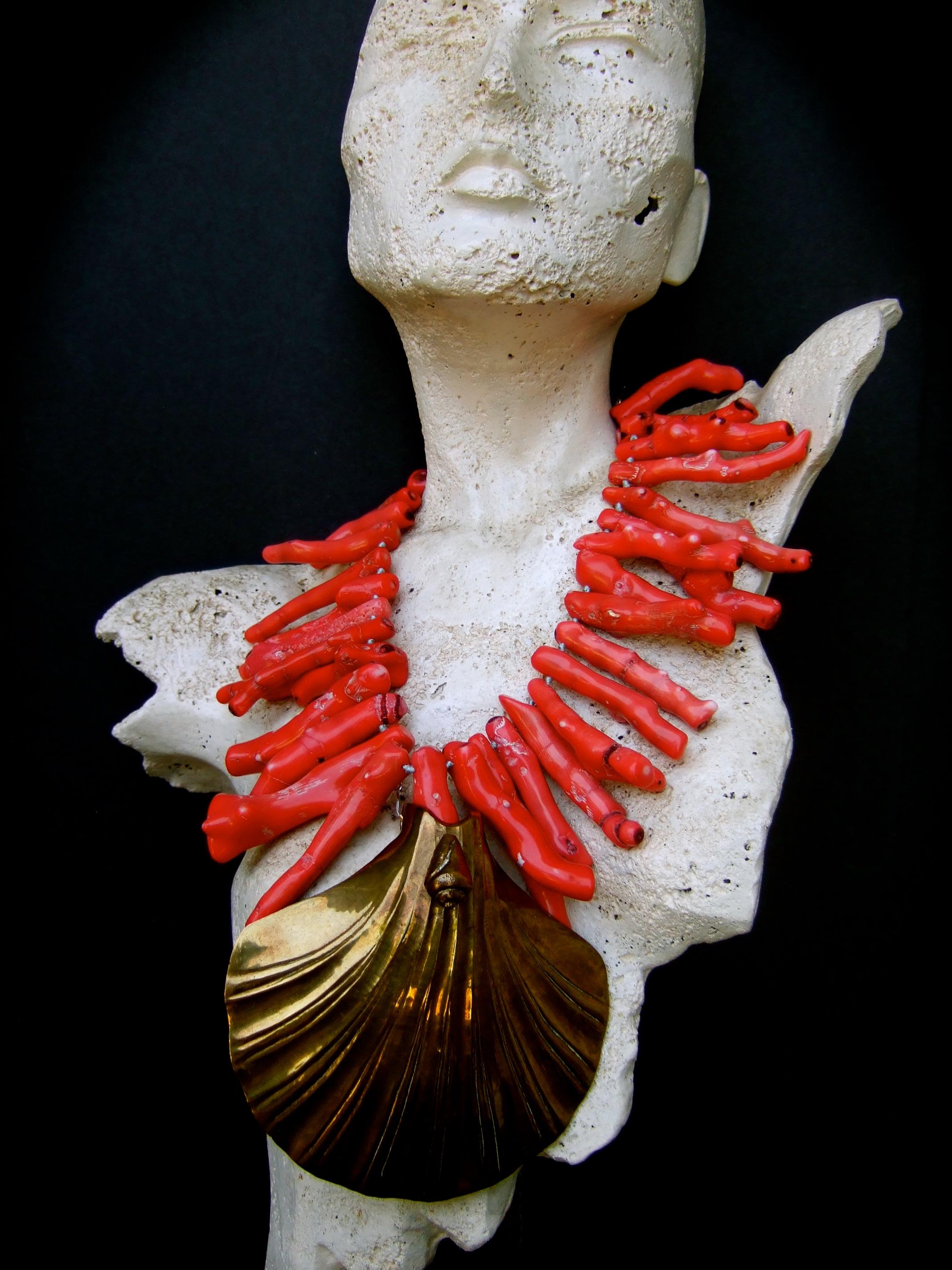 Extraordinary massive coral branch artisan statement necklace 
The avant-garde huge scale necklace is designed with a collection 
of large-scale elongated organic coral branches

Juxtaposed with a huge stylized brass metal scallop shell medallion
