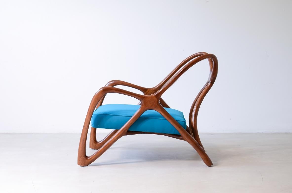 COD-2808
Extraordinary organically shaped armchair in shaped wood with a padded fabric seat.

A unique piece of fine handcrafted cabinetry.

Made in Italy, this model can be replicated upon request.