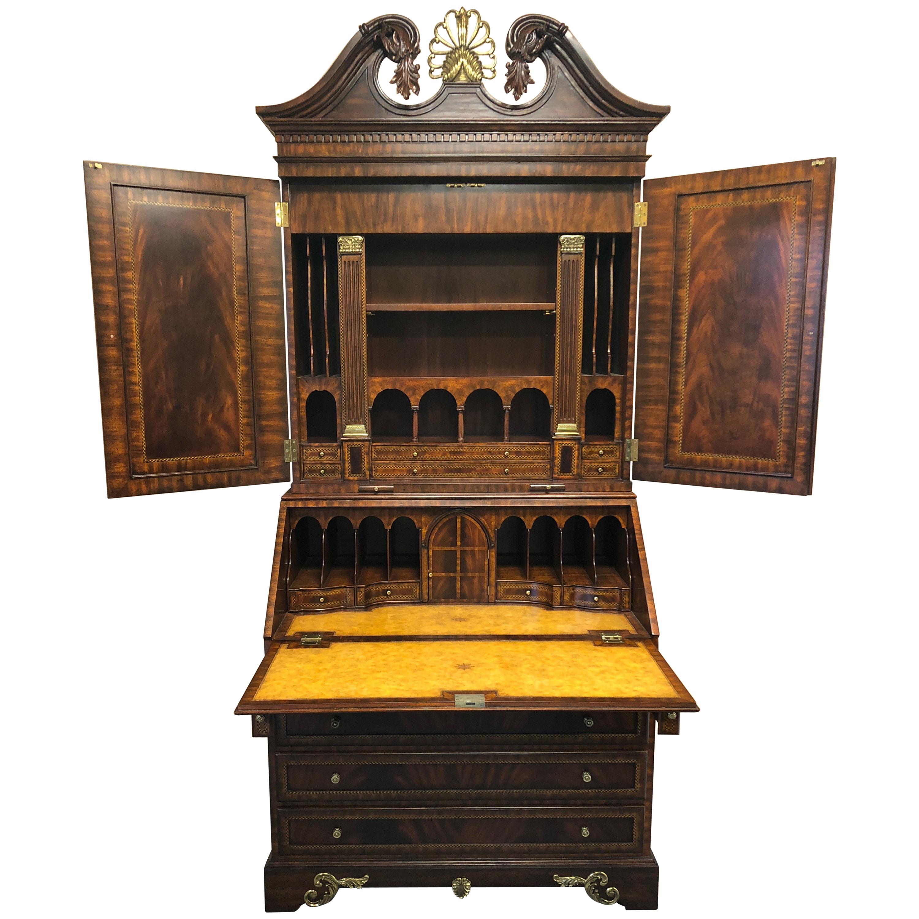 A superior impressively intricate secretary having amazing details such as satinwood and ebony inlay, leather embossed desk surface, a pair of slide out candle holders, gorgeous neoclassical decorations, tons of cubbies and a tudor or gothic style