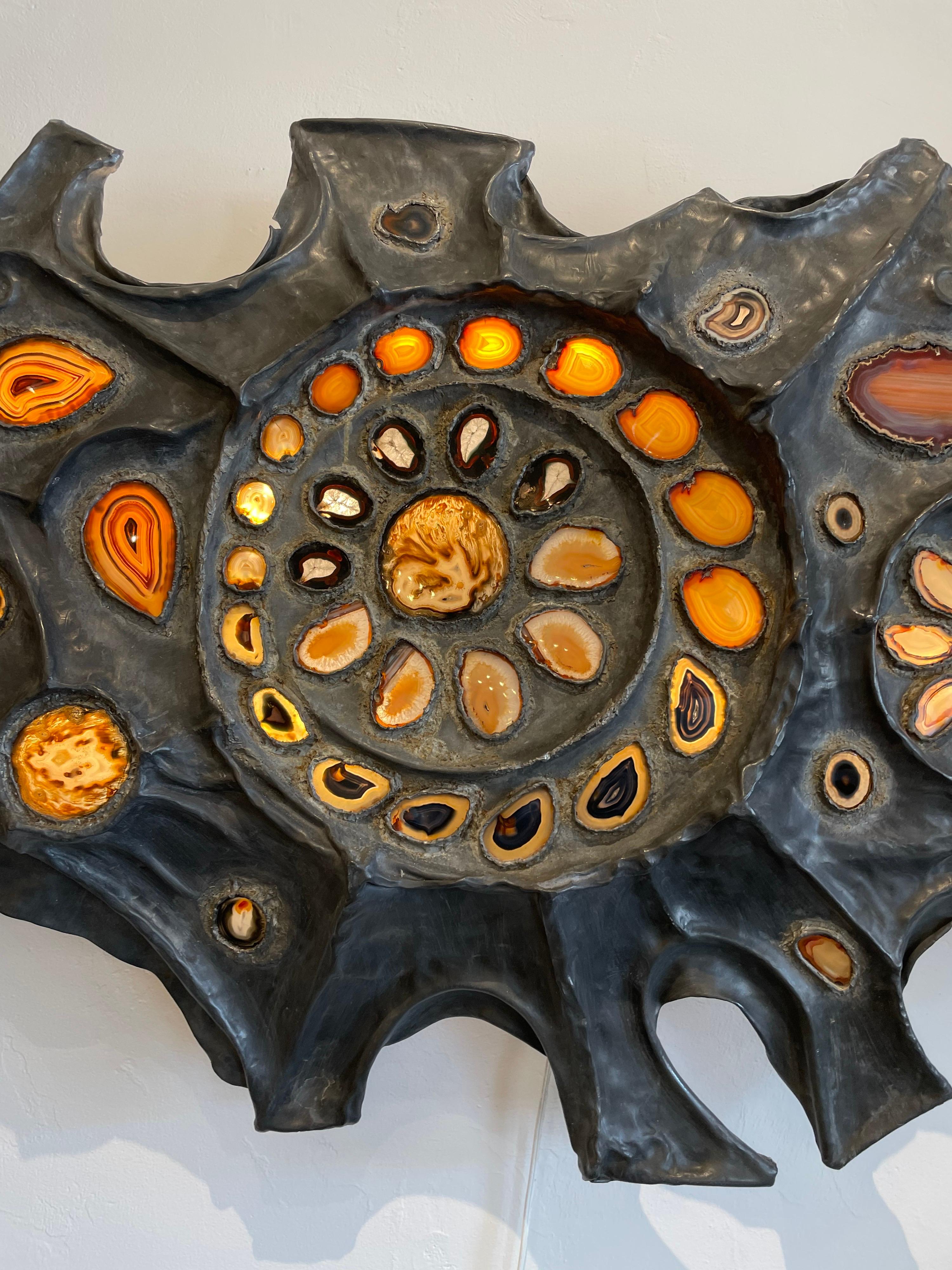 This over the op vintage French lead metal and agate slices which are beautifully illuminated from behind in an organic free form style wall sculpture. Natural colorings to agate - see all pics.