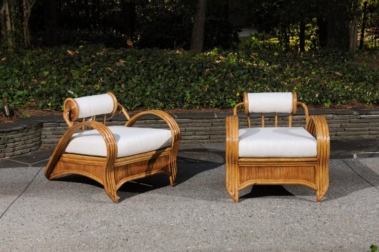 This magnificent pair of rare lounge chairs is unique on the market. They are shipped as professionally photographed and described in the listing narrative: Meticulously professionally restored and installation ready. Expert custom upholstery