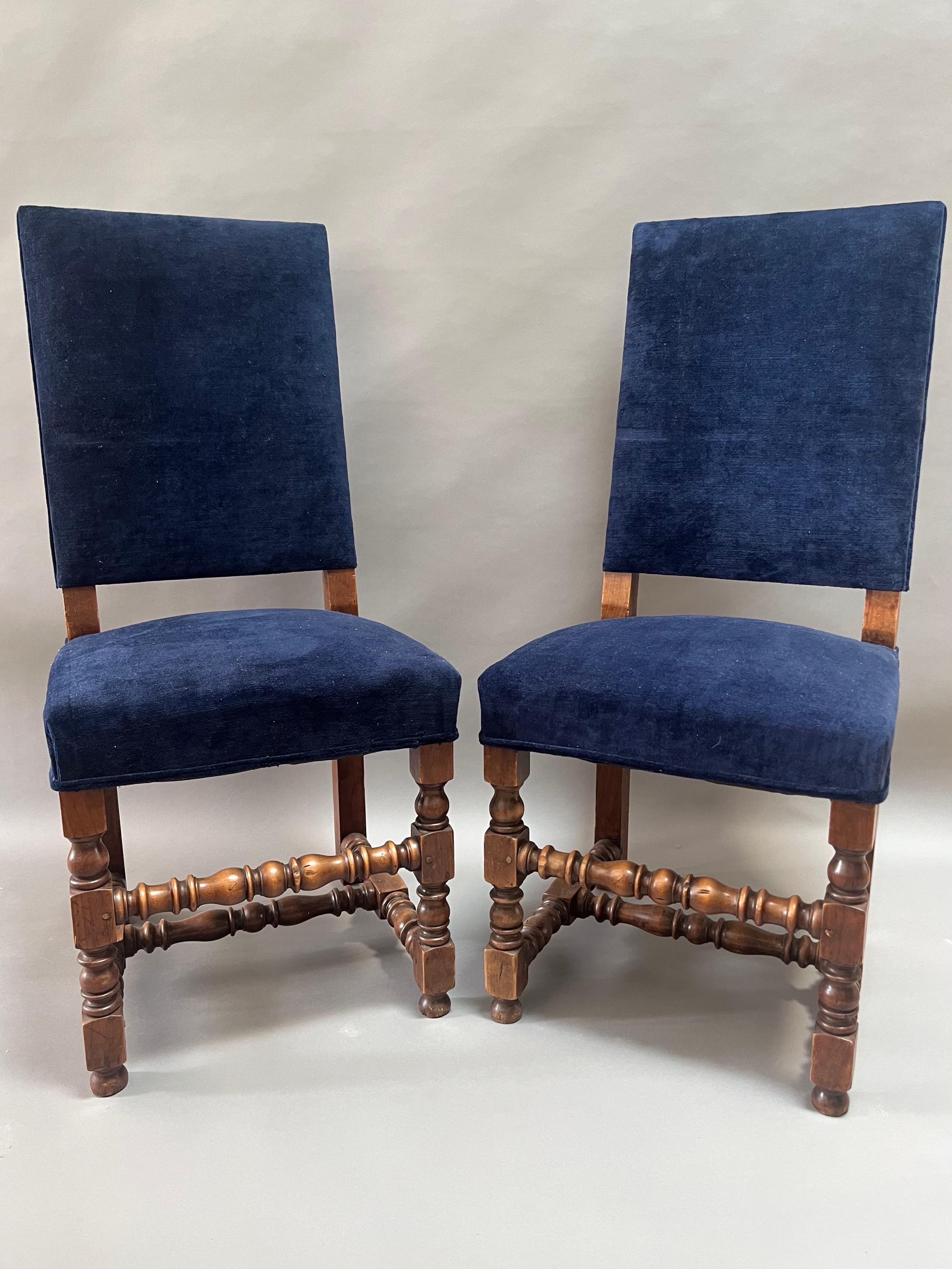  Extraordinary Pair of French Louis XIV  Period 17th Century Armchairs.   Made of Richly Patinated Circassian Walnut  with a deep lustrous color. Arched Backs over elegant carved sweeping arms  with beautiful turned uprights and stretchers 