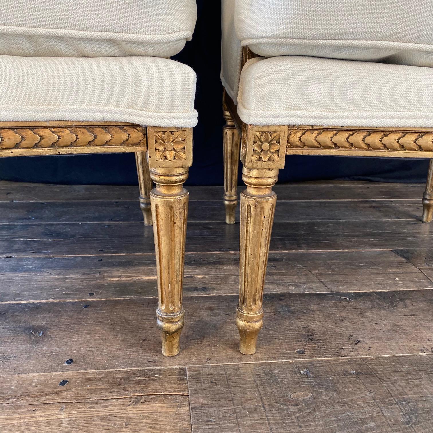 Extraordinary Pair of French Louis XVI Giltwood Wingback Armchairs or Bergeres For Sale 5