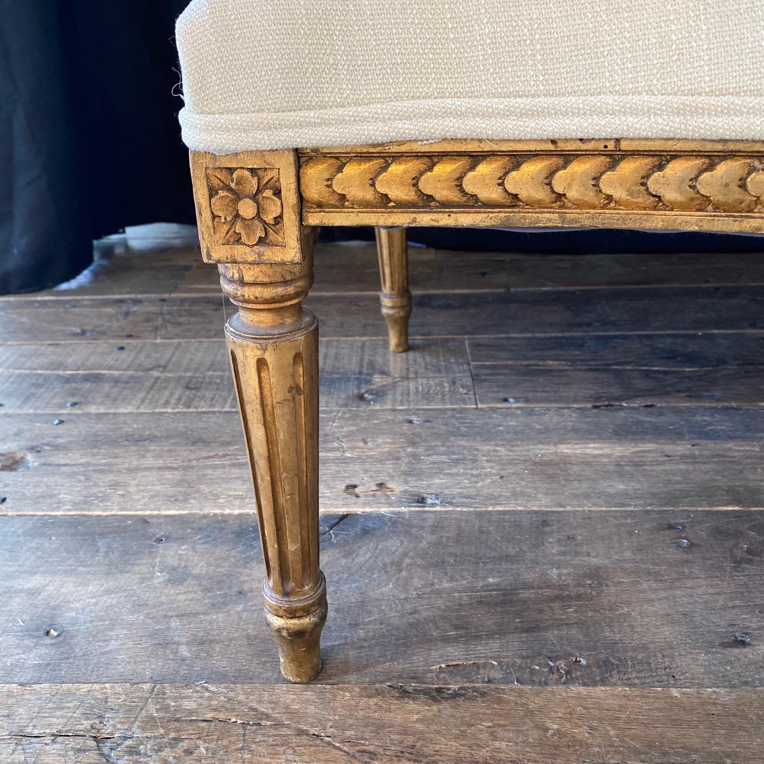 Upholstery Extraordinary Pair of French Louis XVI Giltwood Wingback Armchairs or Bergeres For Sale