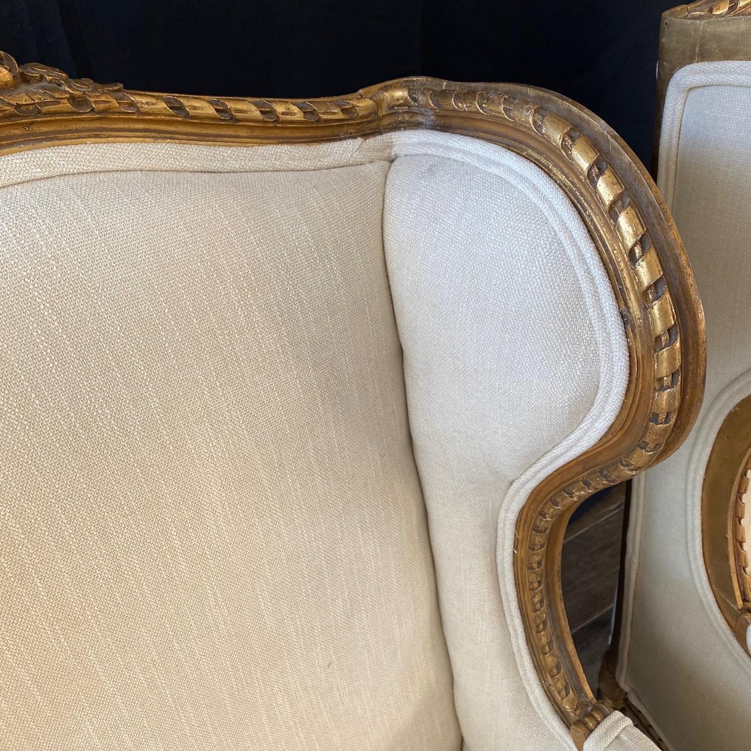 Extraordinary Pair of French Louis XVI Giltwood Wingback Armchairs or Bergeres For Sale 3