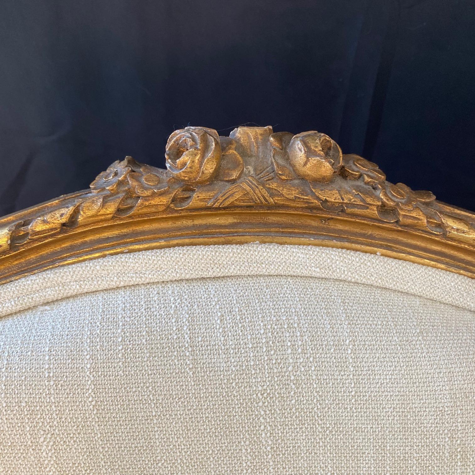 Extraordinary Pair of French Louis XVI Giltwood Wingback Armchairs or Bergeres For Sale 4
