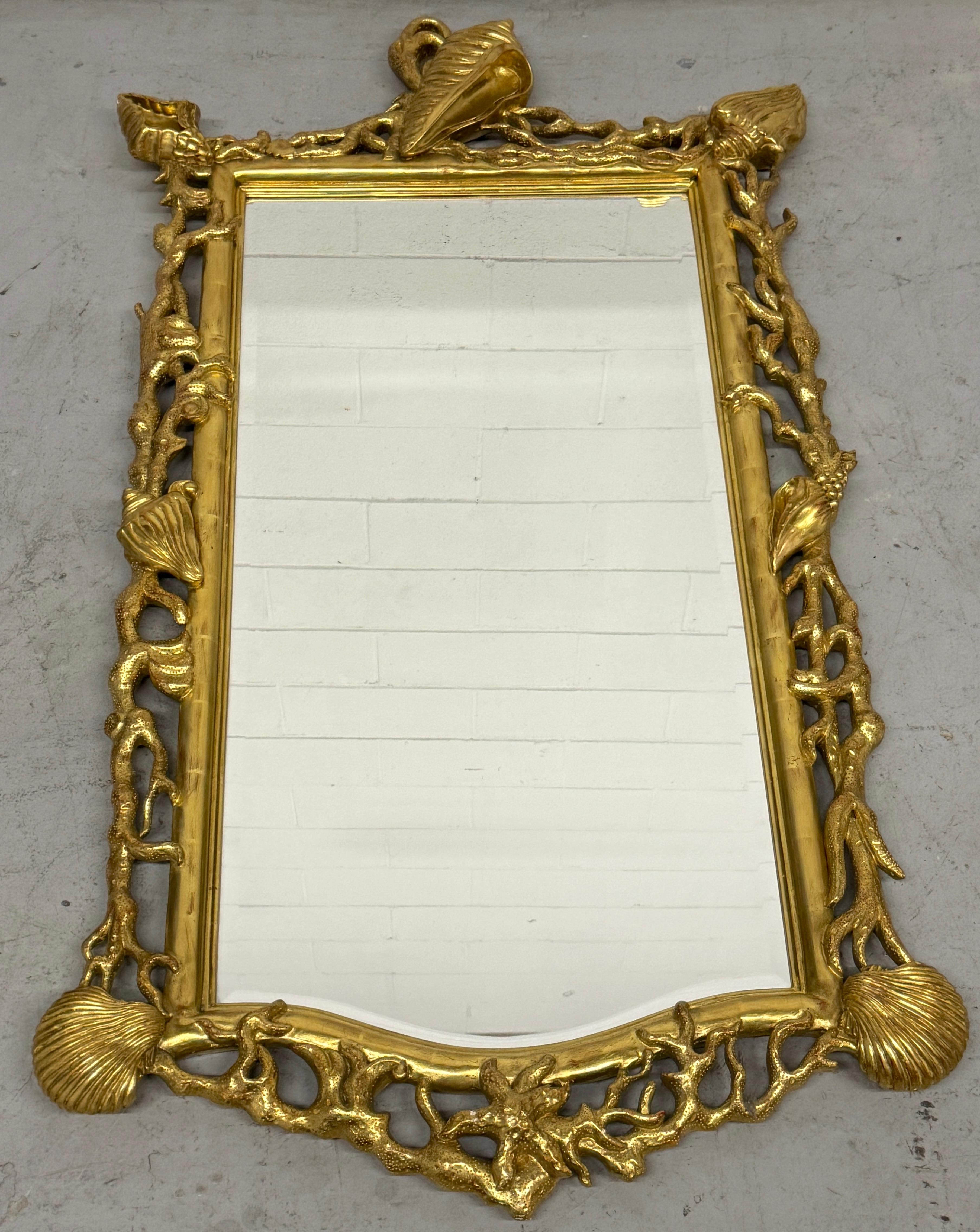 Extraordinary Pair of Italian Carved Giltwood Mirrors with Shell and Coral Motifs, 20th Century

Baroque Revival Meets Sculptural Coastal Design  In the Manner of Tony Duquette

A striking and extraordinary pair of Italian carved giltwood mirrors,