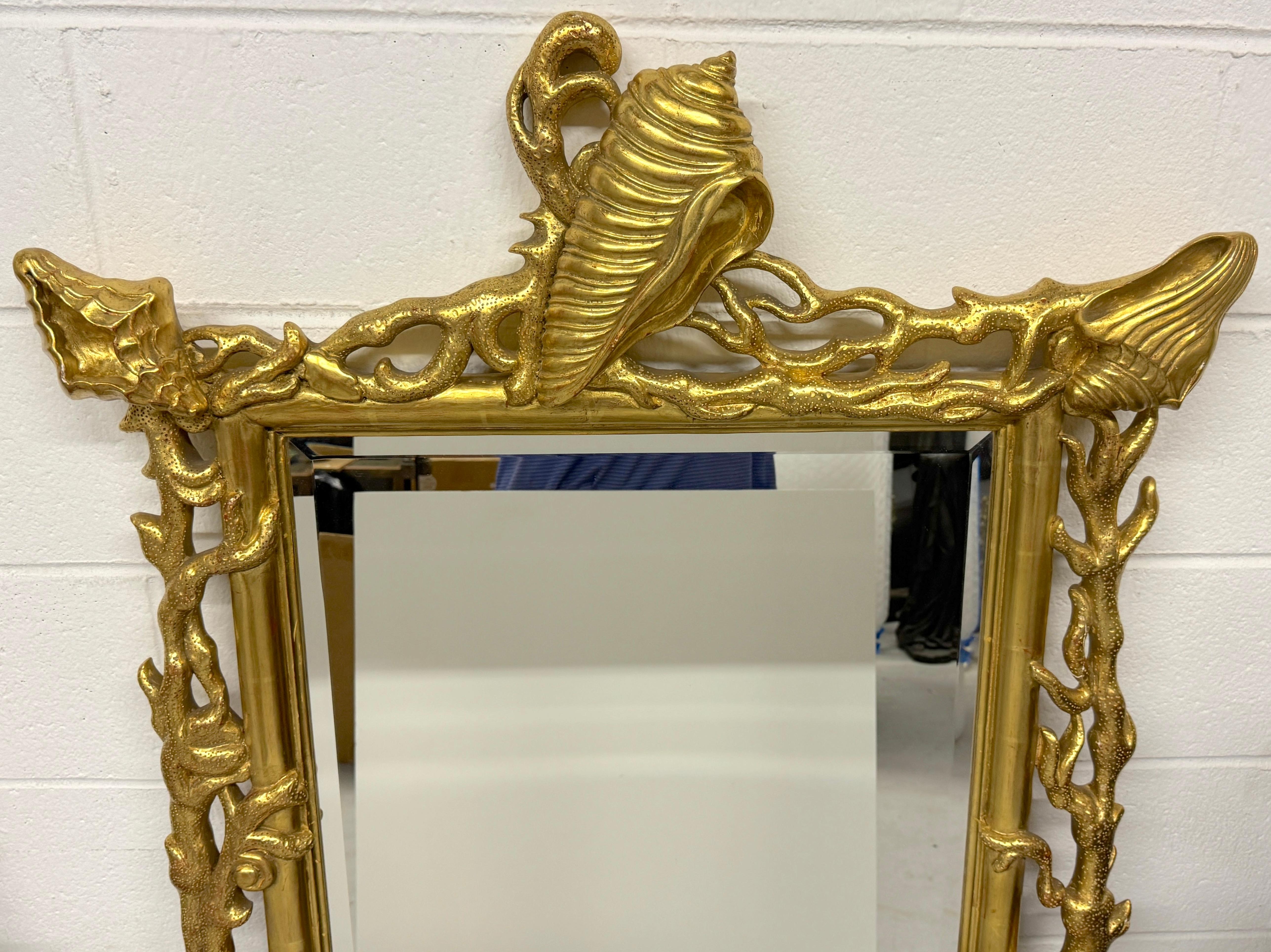 Beveled Extraordinary Pair of Italian Carved Giltwood Mirrors with Shell and Coral Motif For Sale
