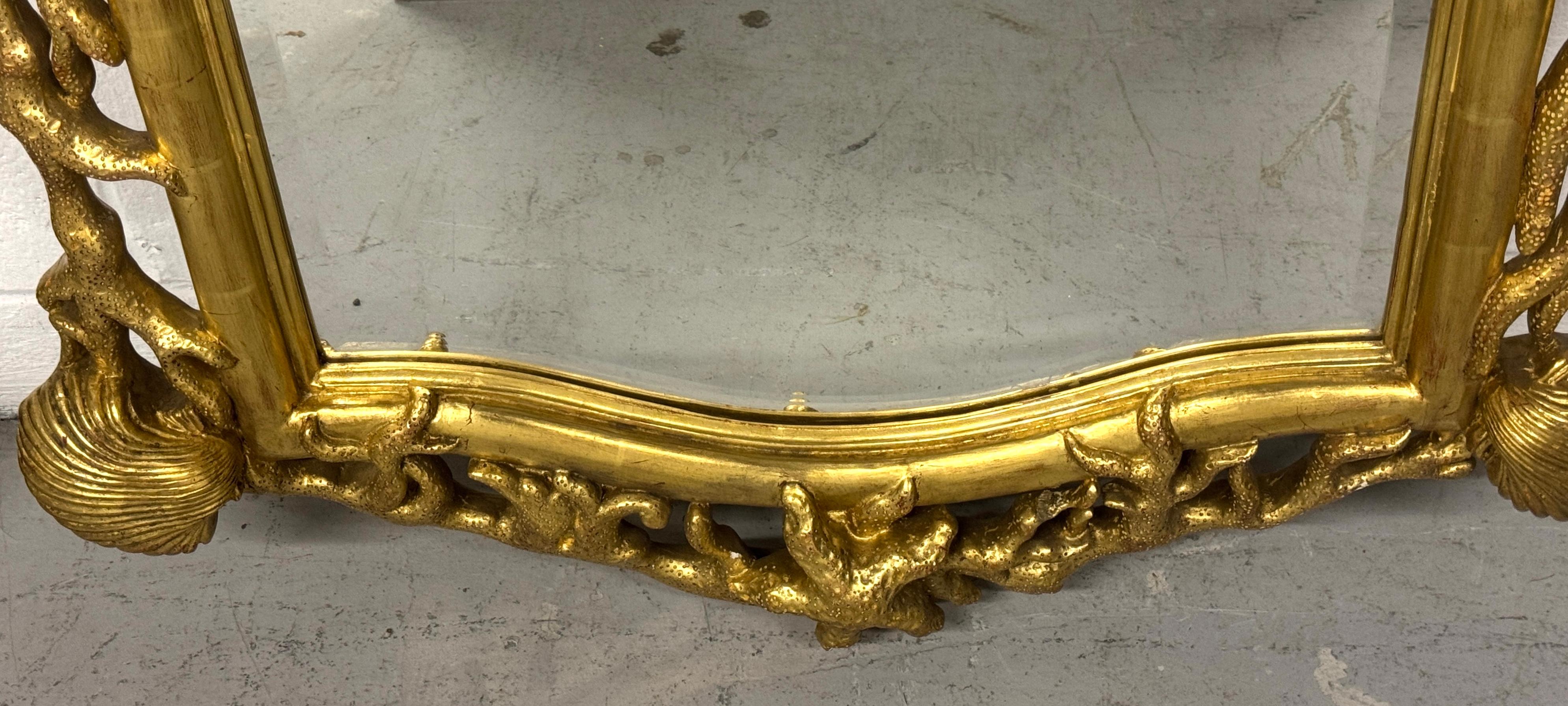 Gesso Extraordinary Pair of Italian Carved Giltwood Mirrors with Shell and Coral Motif For Sale