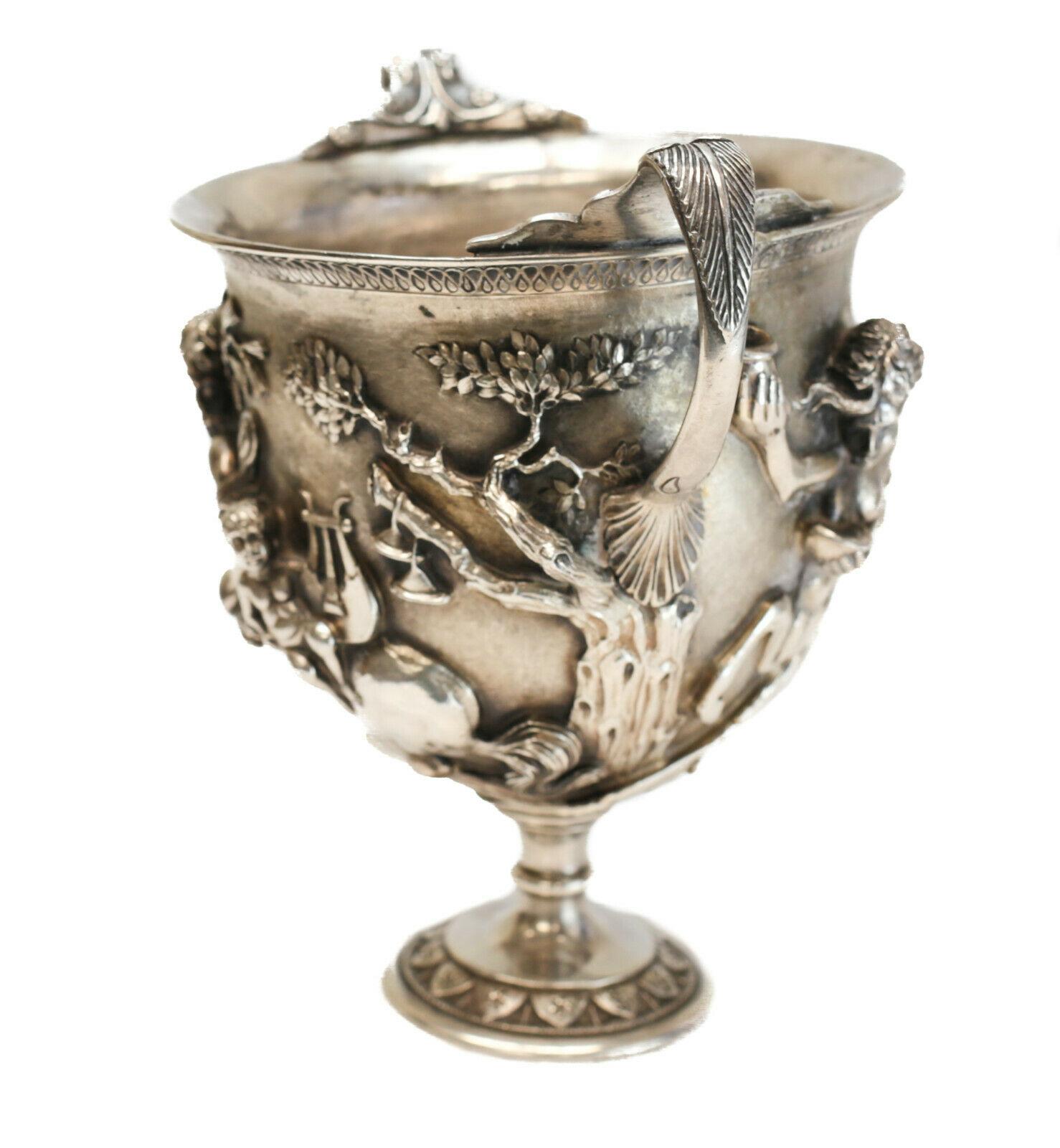 An extraordinary Italian sterling silver Kantharos cup with double handles, by famed silversmith Mabuti for Buccellati, circa 1970. Ornate satyrs and cherubsin deep relief to the central areas, with hand etched detailed throughout. Buccellati silver