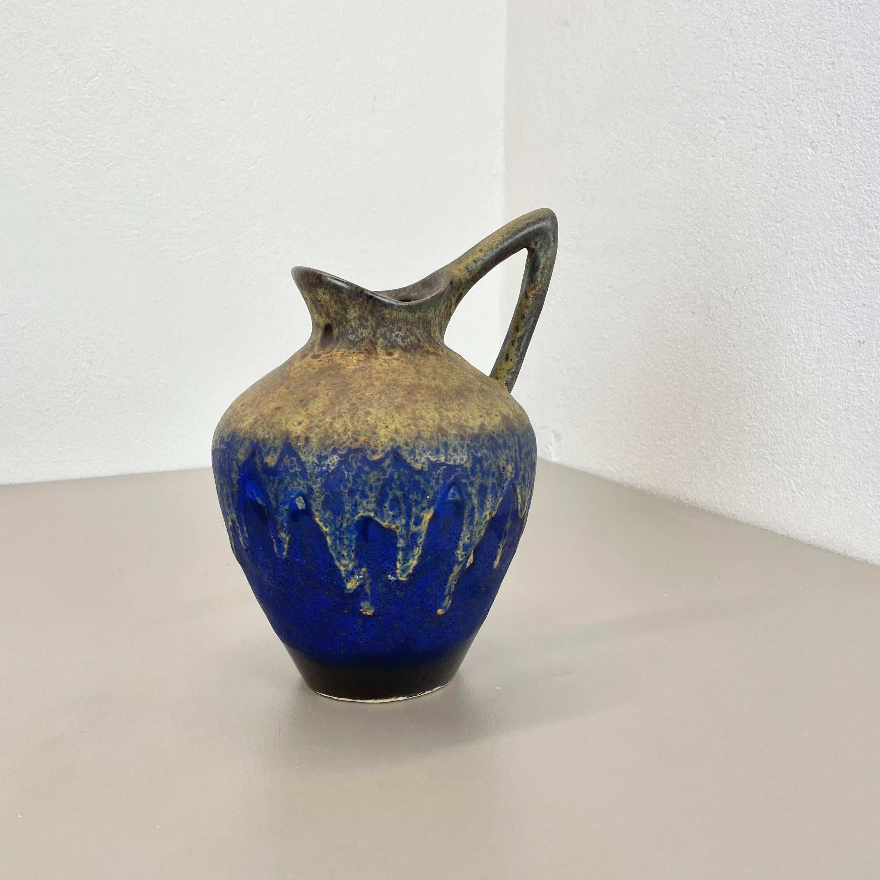 Article:

Fat lava art vase 


Producer:

ES Ceramics, Germany


Decade:

1970s


Description:

This original vintage vase was produced in the 1970s in Germany by premium vase producer ES Keramik. it is made of ceramic pottery in fat lava optic with