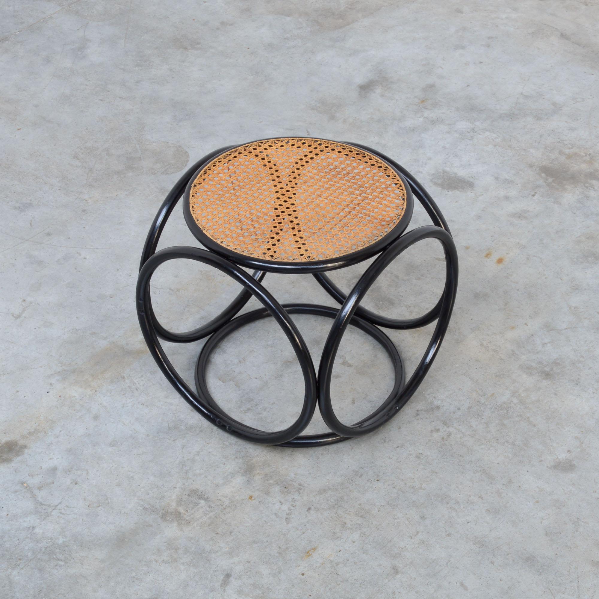 This old bentwood stool was designed and manufactured by Thonet and can be dated in the late 19th or the early 20th century.
This stool has double old screws and the cane seat is very old and handmade.
The black is re-polished.
This stool is an