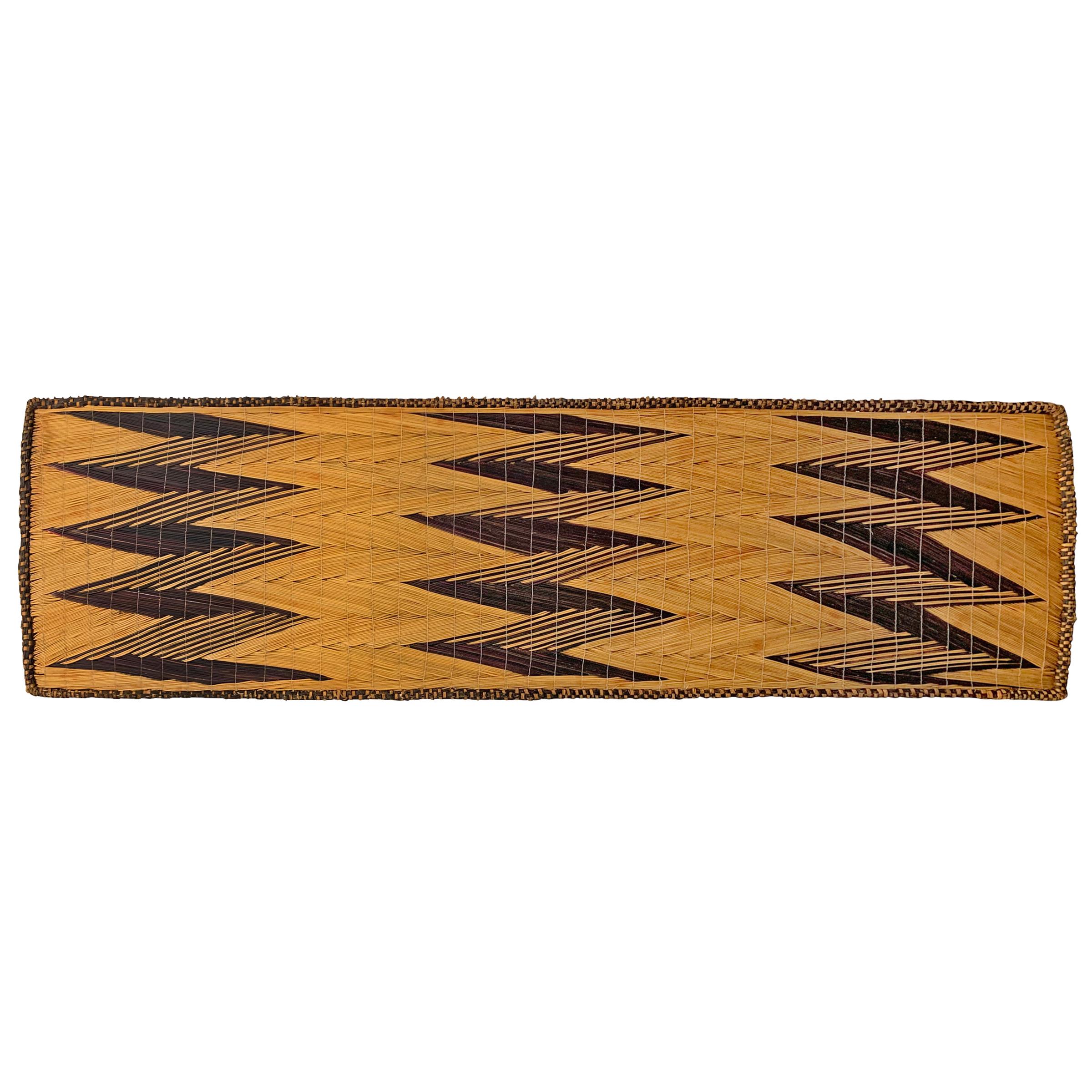 An extraordinary 20th century Tutsi handwoven reed and grass screen with a fantastic geometric pattern woven in dark violet grasses, used to protect milk pots, on custom wall mount that can be hung vertically or horizontally. 

Ex. Rutton-Hourde,