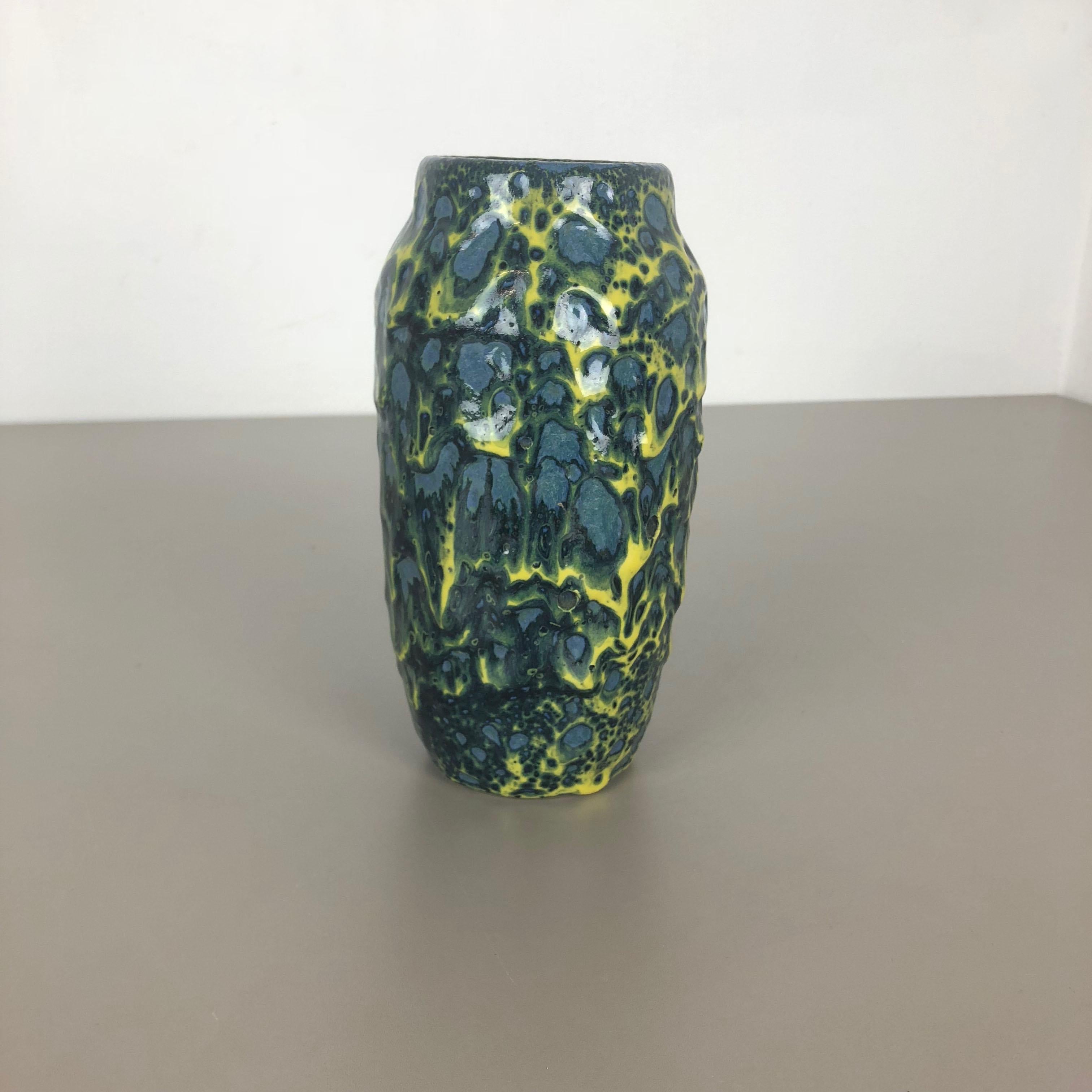 Article:

Fat lava art vase super rare yellow, blue-green coloration


model: 242-22


Producer:

Scheurich, Germany



Decade:

1970s


Description:

This original vintage vase was produced in the 1970s in Germany by Scheurich.