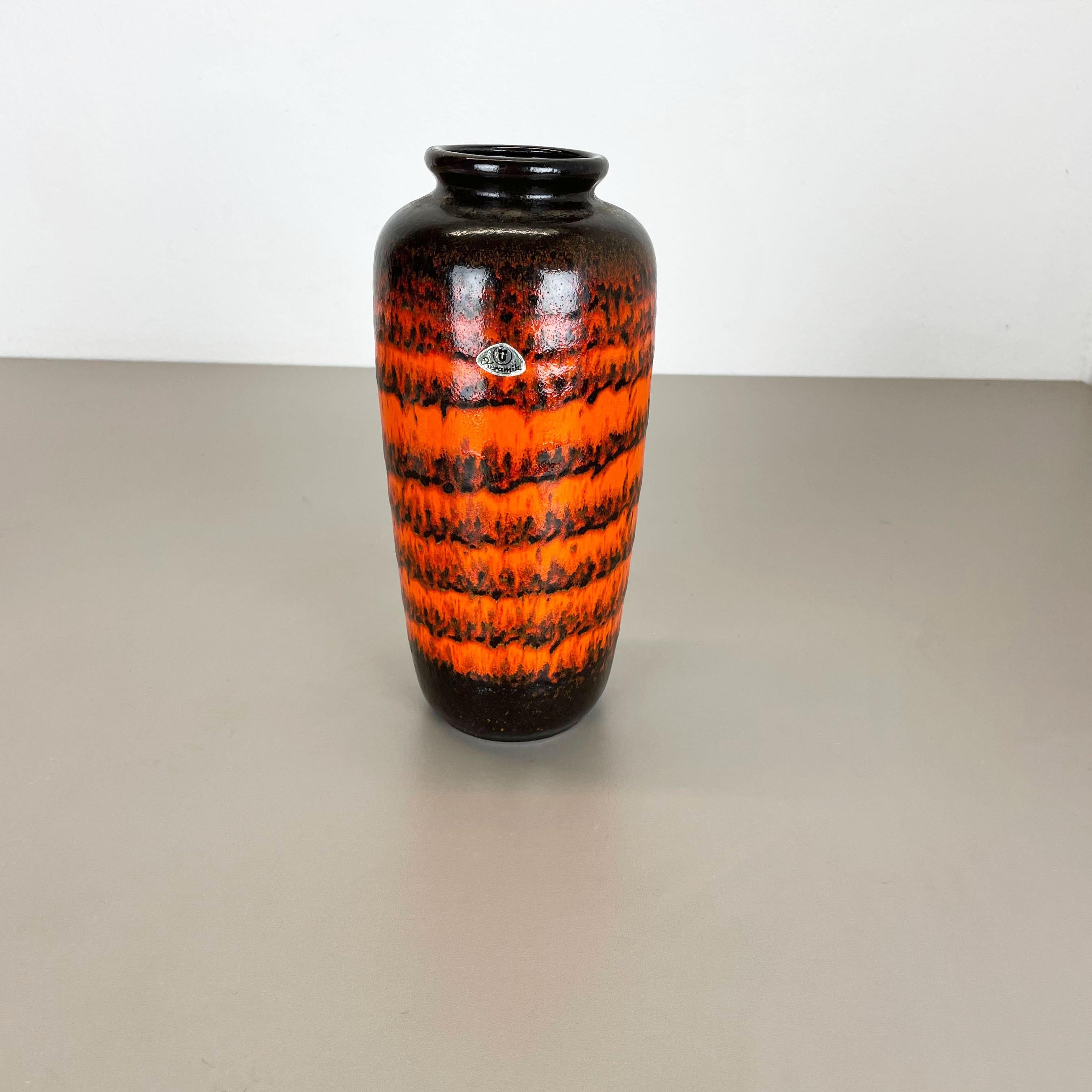 Article:

Fat lava art vase super rare orange, black coloration



Producer:

Ü- Keramik, UEBELACKER, Germany



Decade:

1970s


Description:

This original vintage vase was produced in the 1970s in Germany by Ü-KERAMIK. It is