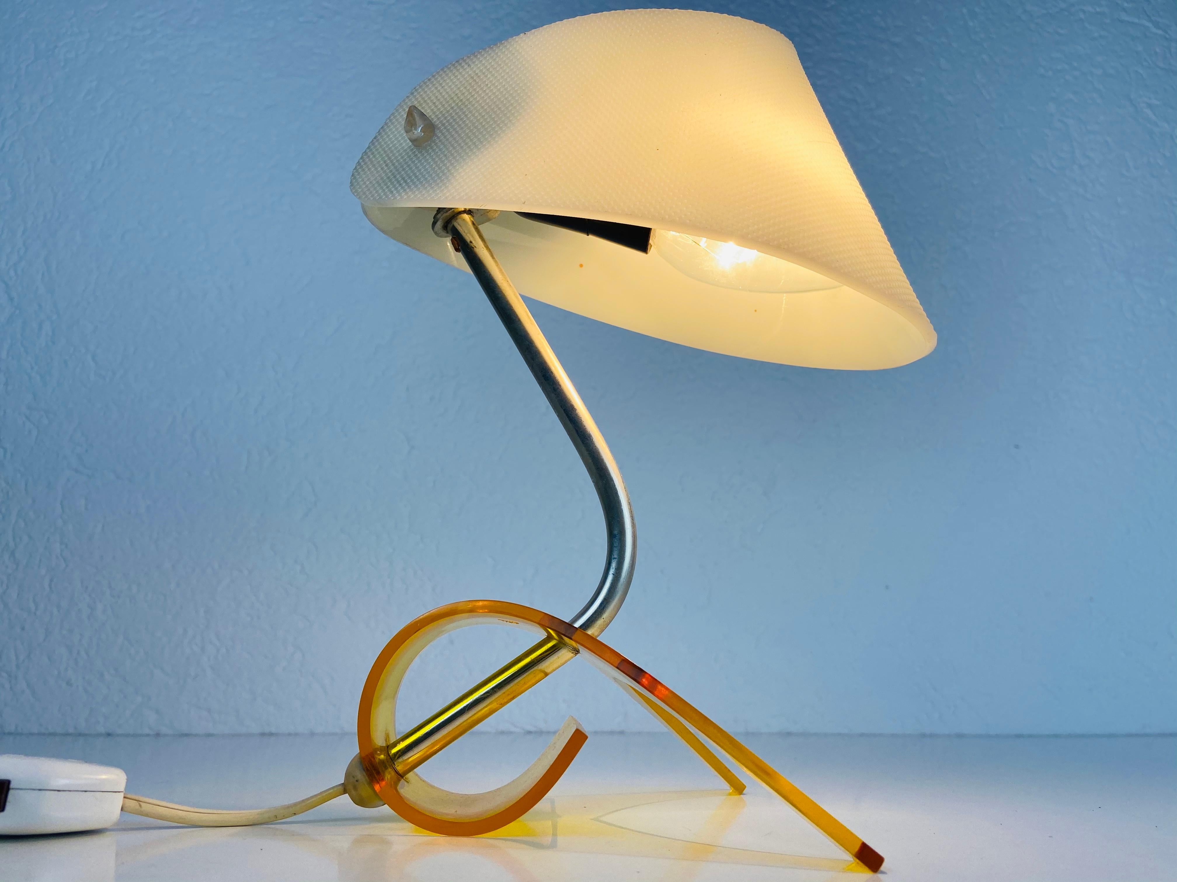 A beautiful table lamp made in Germany in the 1970s. It has an orange base and a white shade. It is in very good vintage condition.

The light requires one E14 light. Works with both 120V/220V.

Free worldwide express shipping.