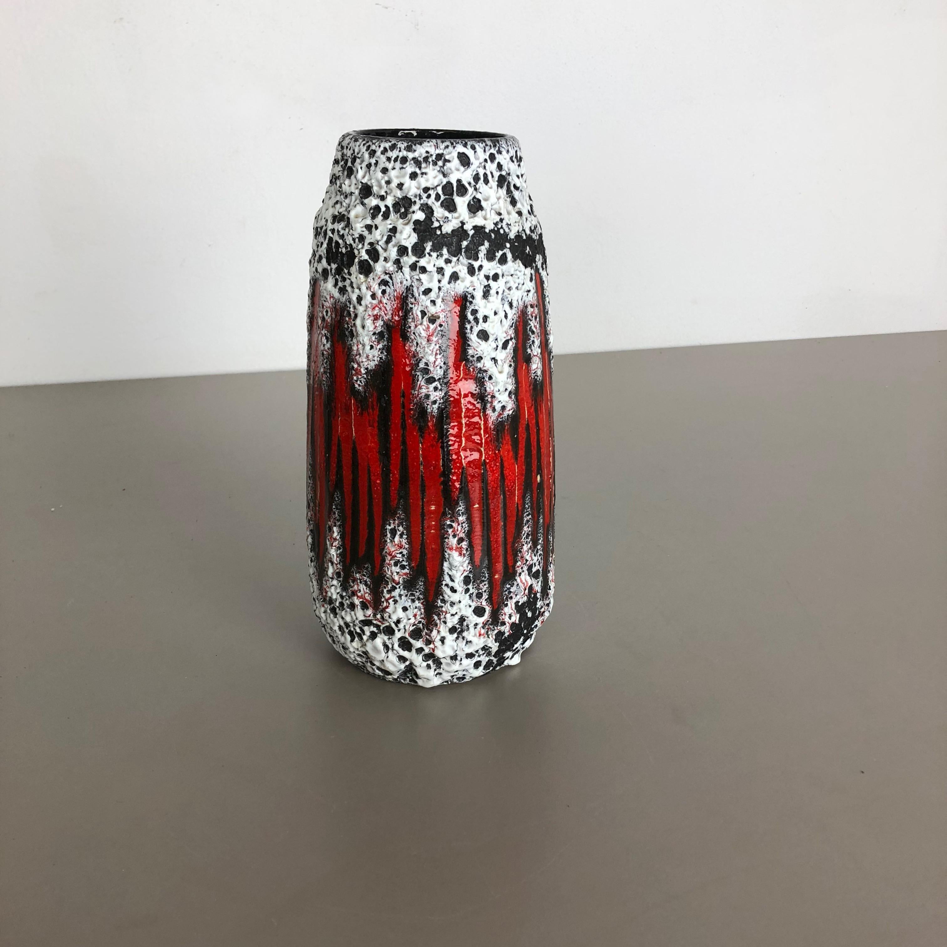 Article:

Fat lava art vase super rare black white red


Model: 203-26


Producer:

Scheurich, Germany



Decade:

1970s




This original vintage vase was produced in the 1970s in Germany by Scheurich. It is made of ceramic