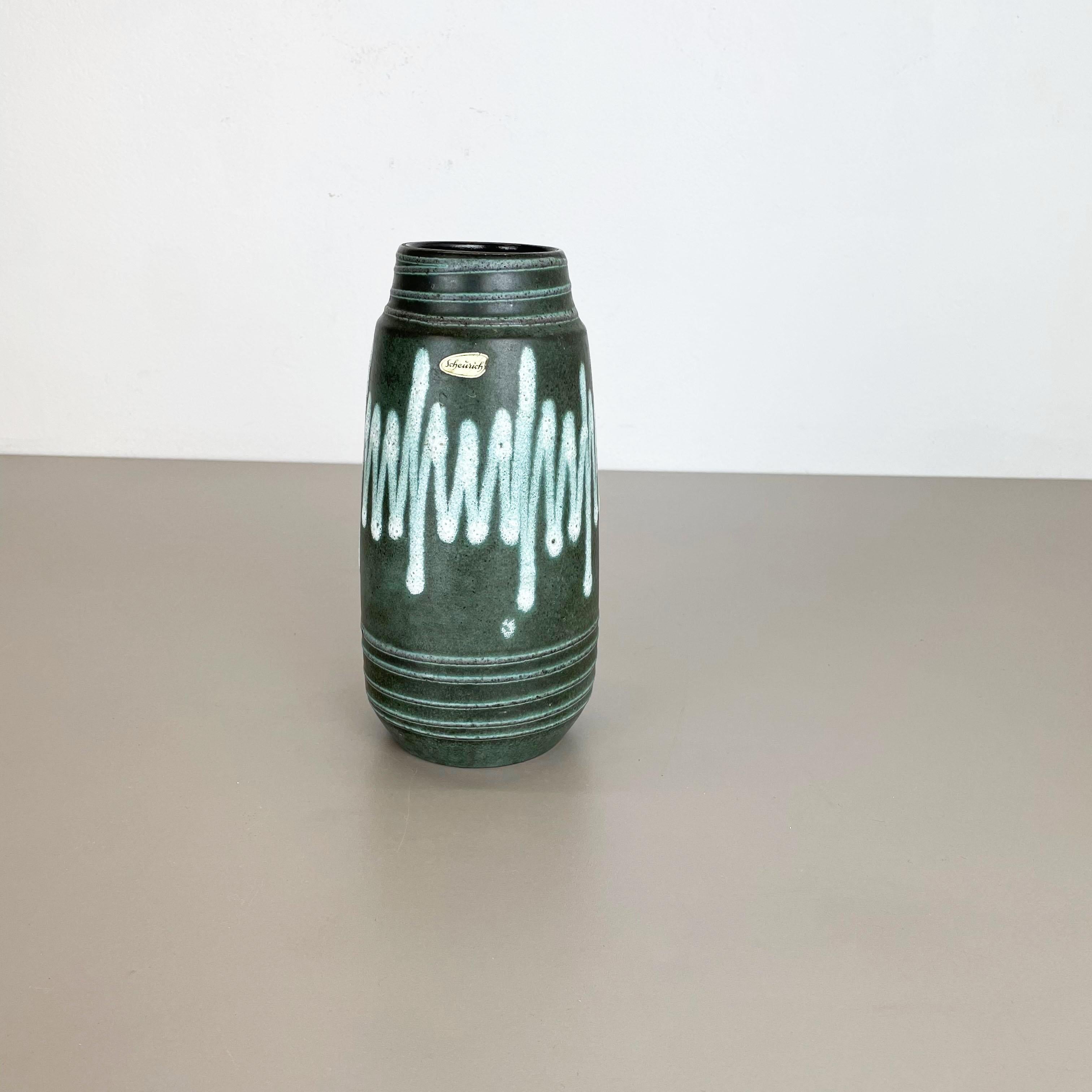 Article:

Fat lava art vase super rare green white coloration


Model: 203-26


Producer:

Scheurich, Germany



Decade:

1970s




This original vintage vase was produced in the 1970s in Germany by Scheurich. It is made of