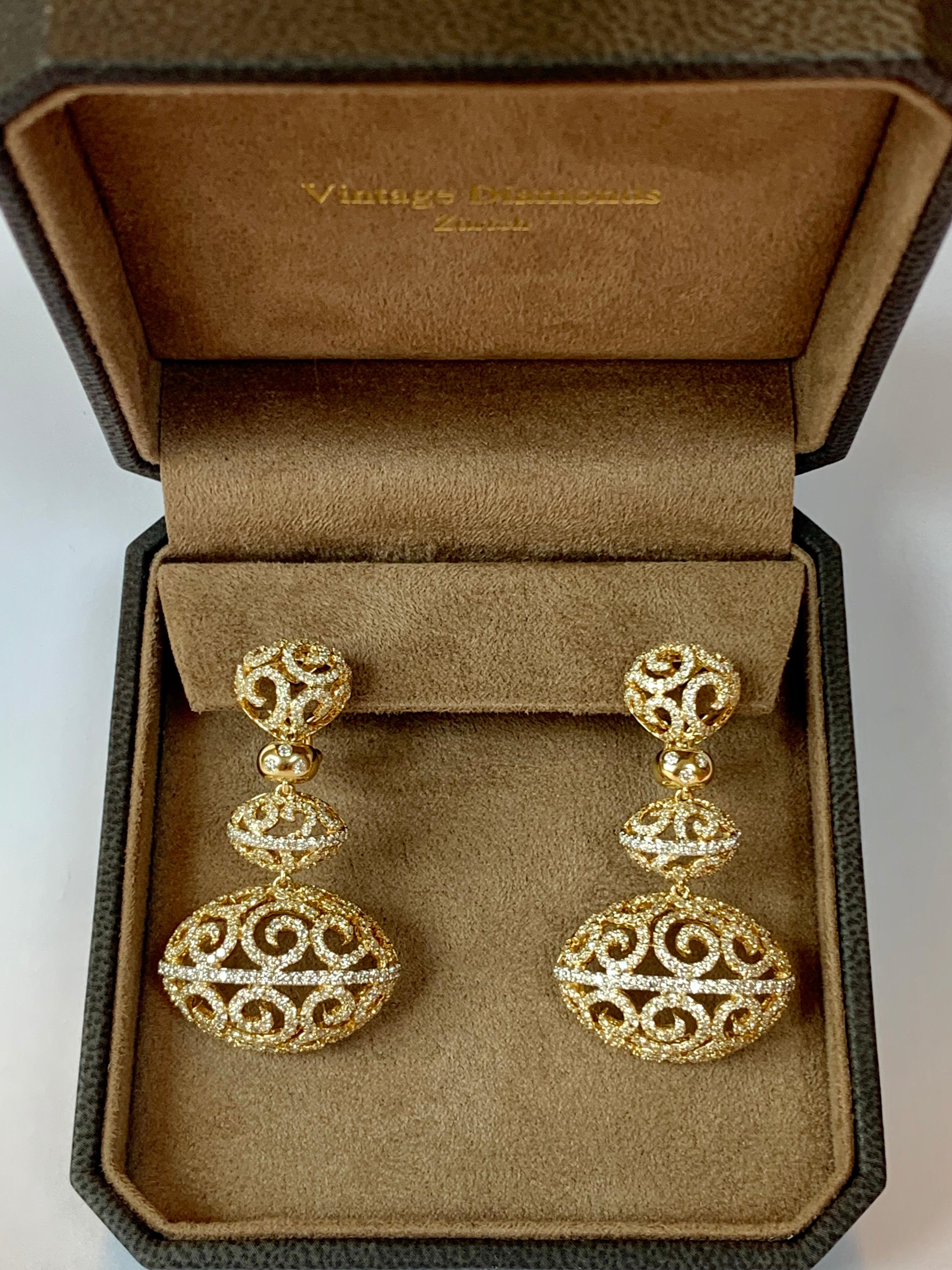 A real pair of statement earring in 18 K Gold that makes heads turn! Intricate workmanship distinguishes these fabulous earrings.  Set with 722  brilliant cut Diamonds weighing 5.27 ct, G color, vs clarity. Matching necklace available!
Masterfully
