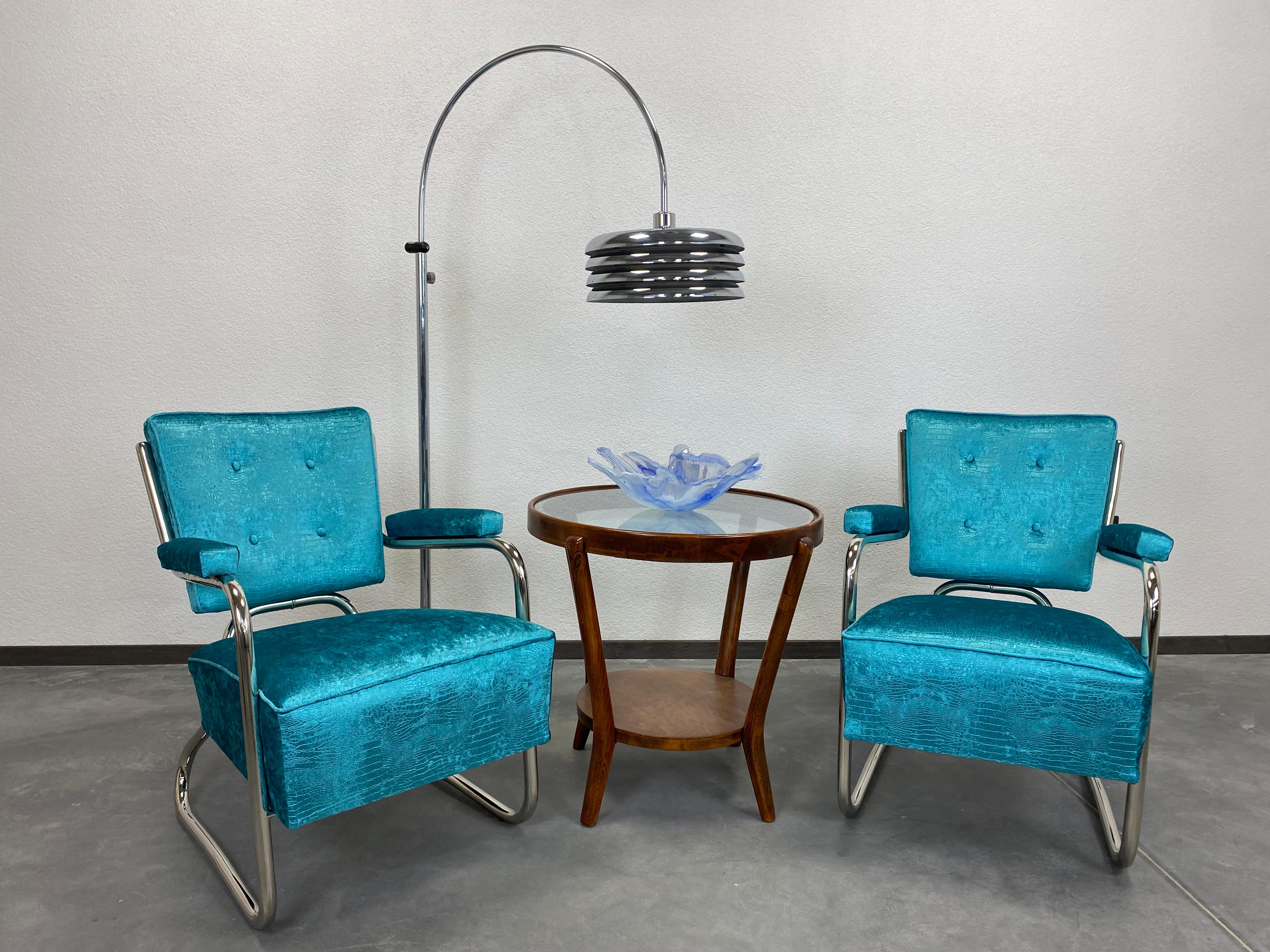 Extravagant chrome Bauhaus armchairs, completely restored, new chrome plating, very high quality patterned Spanish fabric.