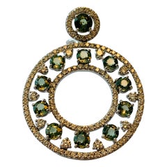 Extravagant Circle Drop 18 Karat White Gold Diamond and Green Sapphire Earrings