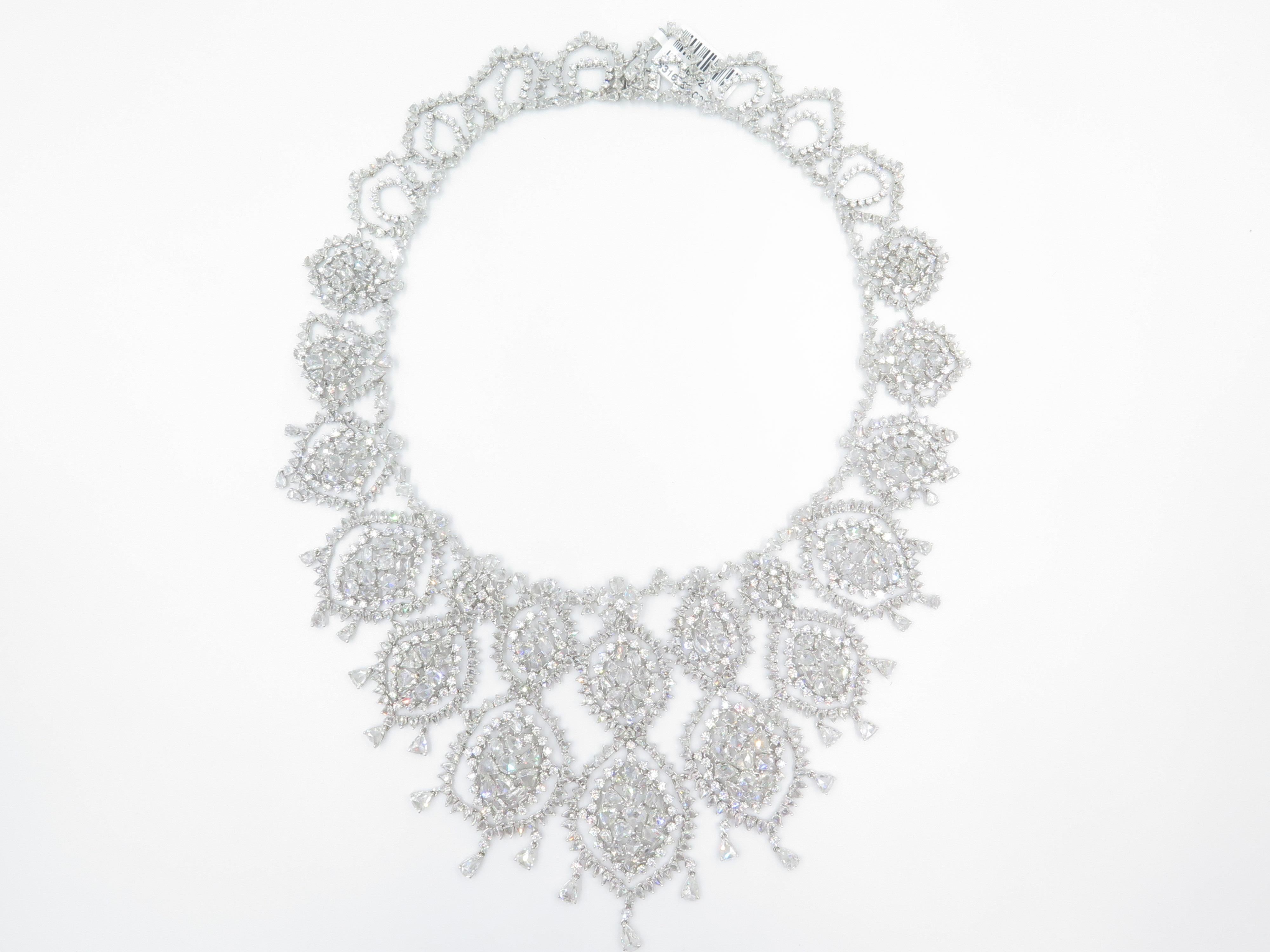 Dazzling and glamorous, this extravagant diamond statement necklace is a real eye catcher! Delicate in design yet dramatic in size, this neck piece showcases 82.01 carats of sparkling diamonds, intricately entwined in 18k white gold.  