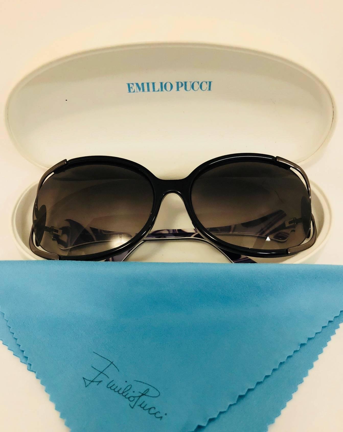 Emilio Pucci EP608S features shiny black frame with gradient grey Rx-able lenses that are engineered to protect your eyes from harmful UV rays and glare. Around the frame pewter tone metal decoration and Pucci logo plaque is used to provide