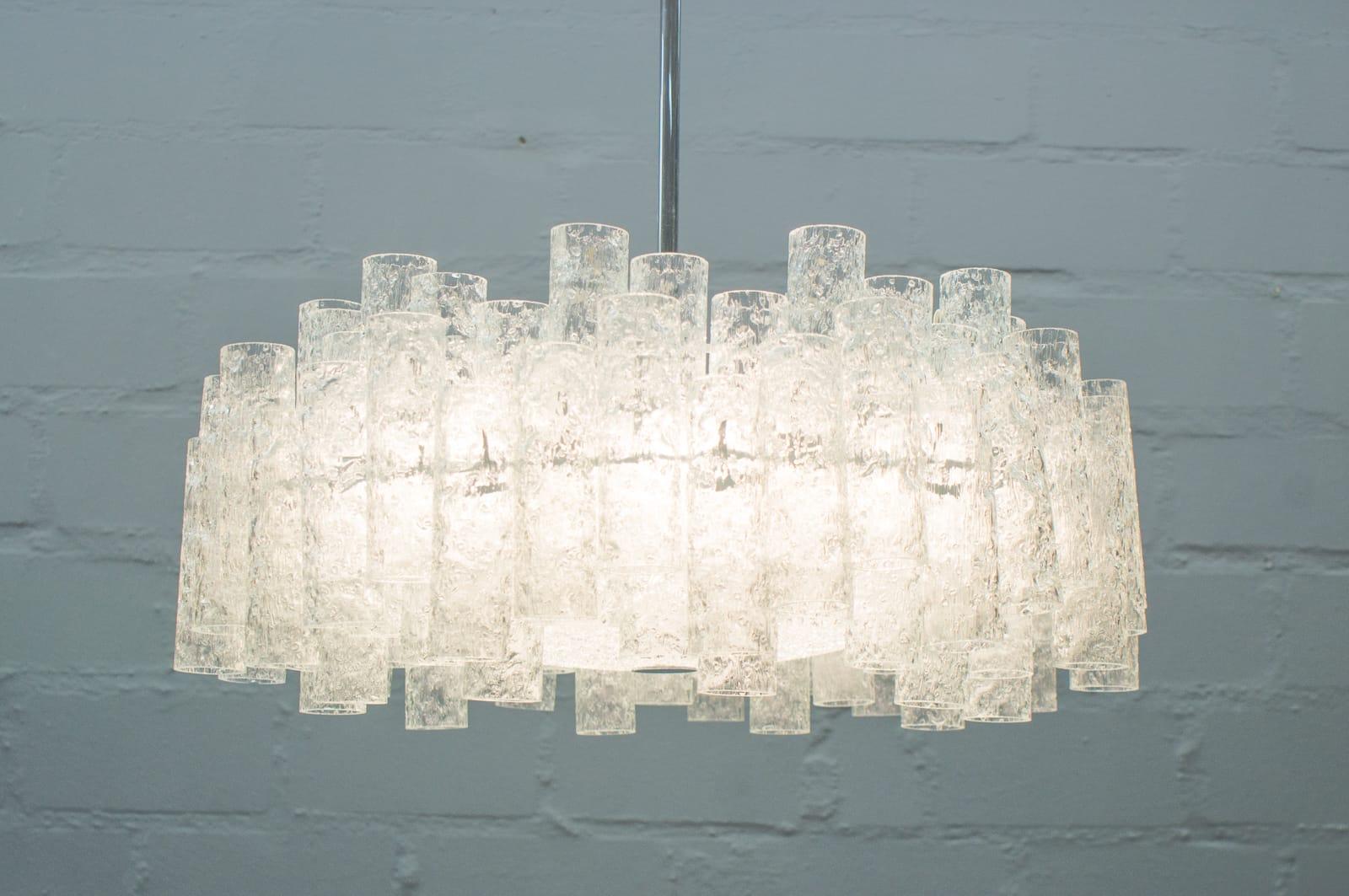 This two-tier chandelier was made by Doria Leuchten. It features 69 glass elements and E14 sockets.


