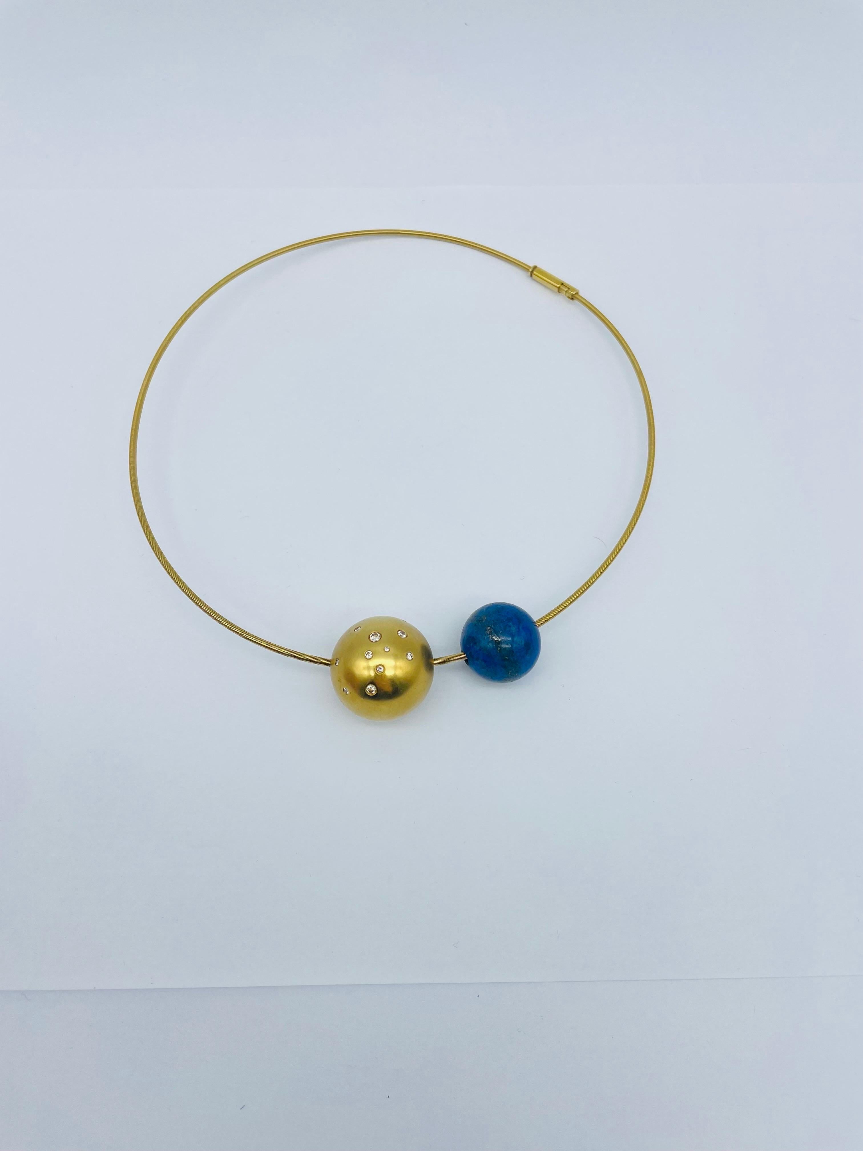 Extravagant Necklace from the renowned brand Niessing. This piece of jewelry is a true testament to the beauty and craftsmanship that can be achieved with precious metals and stones.

Crafted from 18k yellow gold, this necklace exudes a timeless