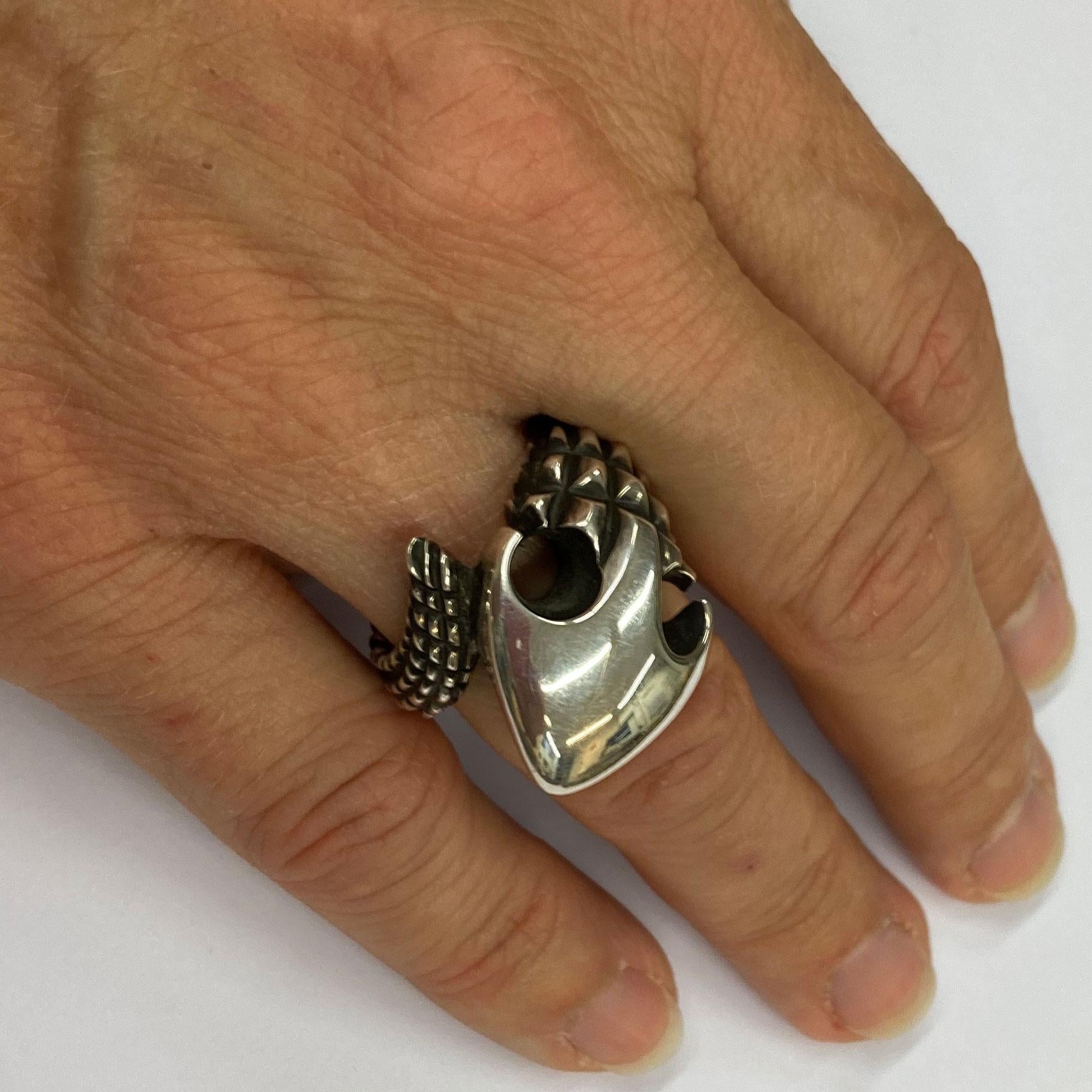 Solid Sterling Ring in a crazy wild look! The three-dimensional design evokes a strong contrast between light and shadow. 
An elegant and snakelike motion around your finger.
Size 17 / 8 . The Ring can be resized smaller or bigger.
This extravagant