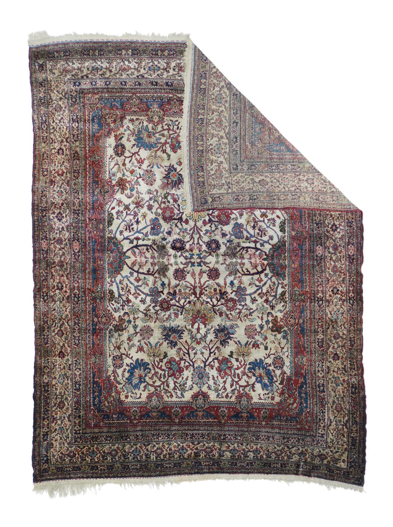We attribute this silk-pile, finely woven scatter to the west Persian Kurdistan town of Senneh, although it may be more of a Senneh-baf (Senneh-weave) Tabriz from further to the northwest. The sand field shows a pallmette, rosette and short stem