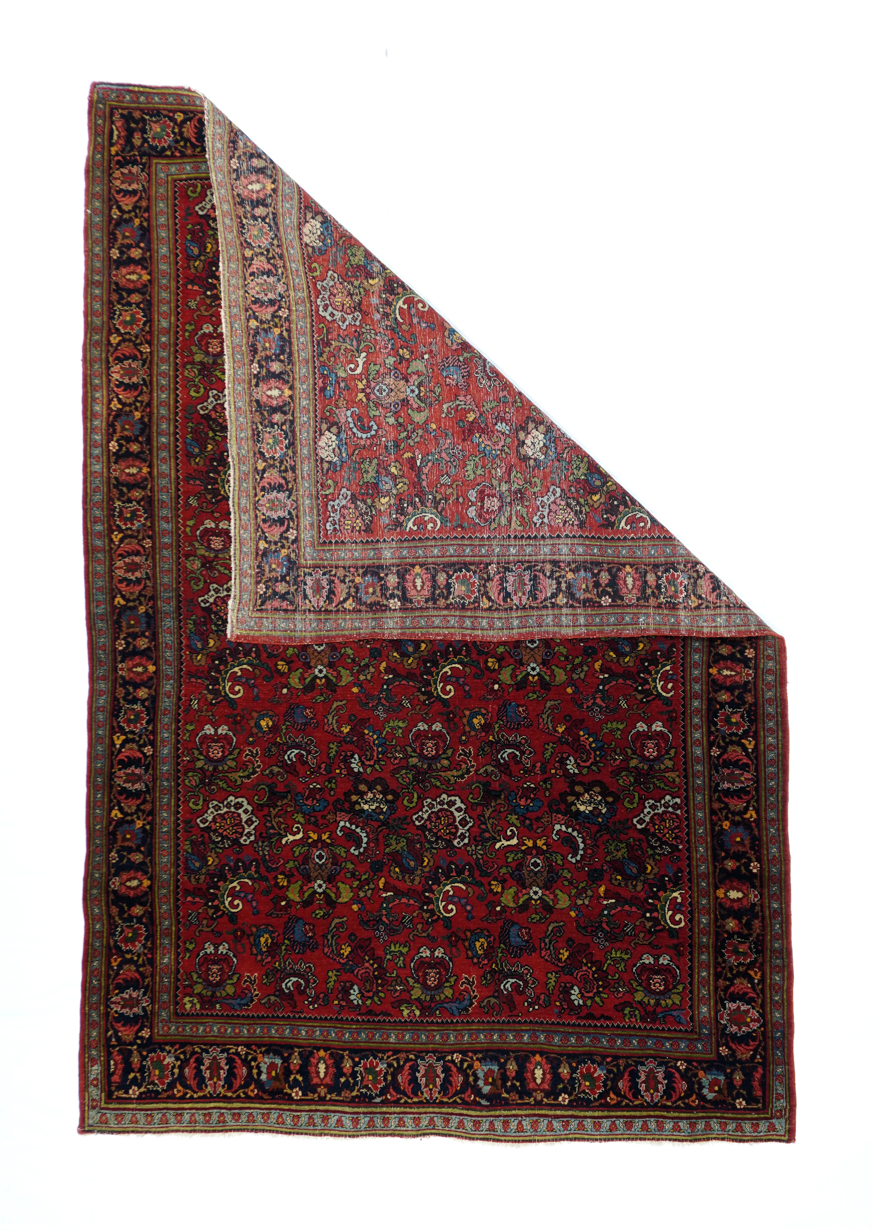 This virtually indestructible, board-like Kurdish city scatter from NW Persia, shows a saturated tomato red field with a close, allover textile pattern of elaborately curved leaves, layered exploding palmettes and imaginative small Rococo vegetal