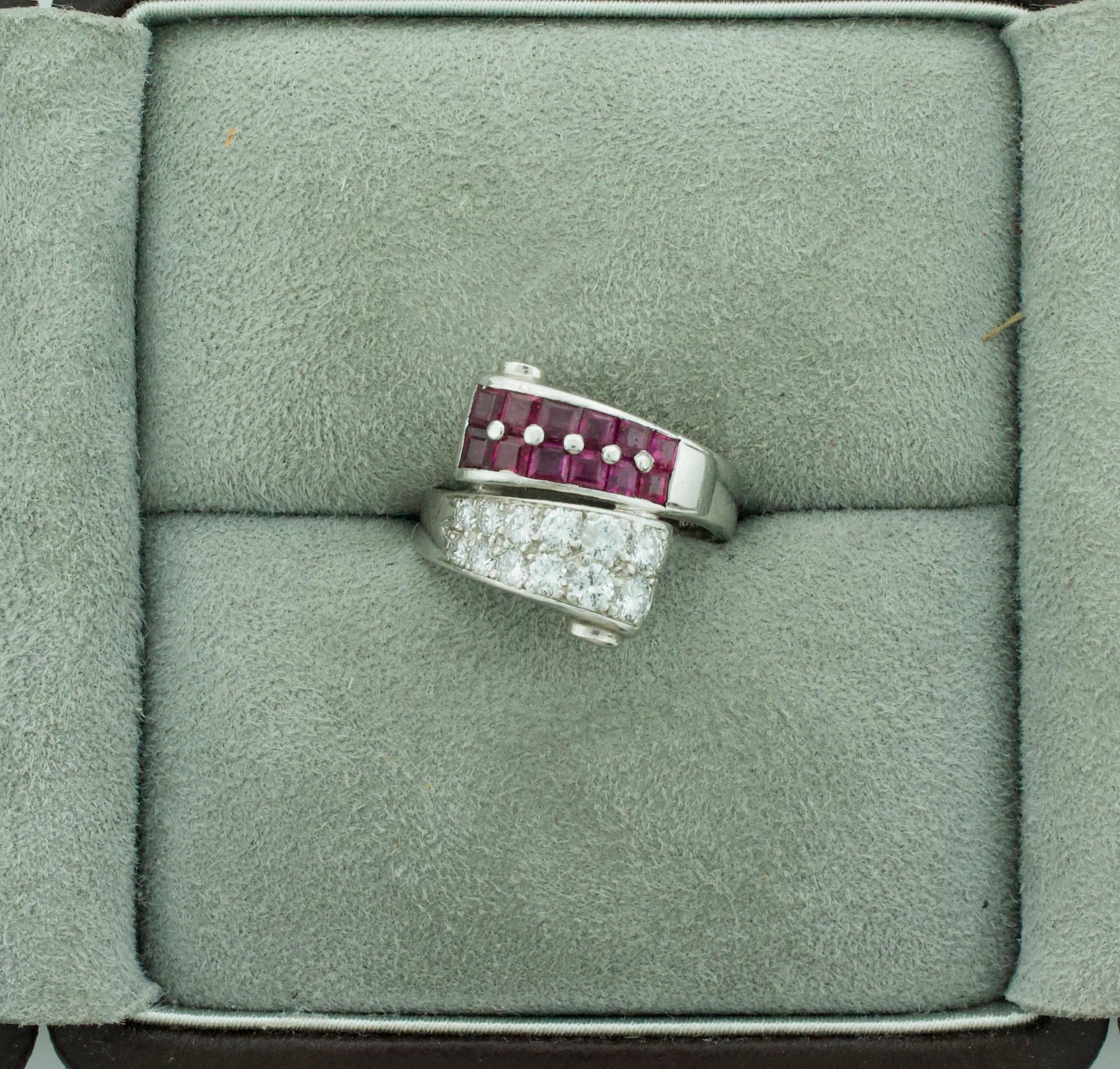 Extreme Art Deco and Diamond Ring Circa 1930's
Twelve Square Cut Rubies Weighing 1.00 Carats Approximately [bright with no imperfections visible to the naked eye]
Twelve Round Brilliant Cut Diamonds Weighing .45 Carats Approximately 
Currently Size