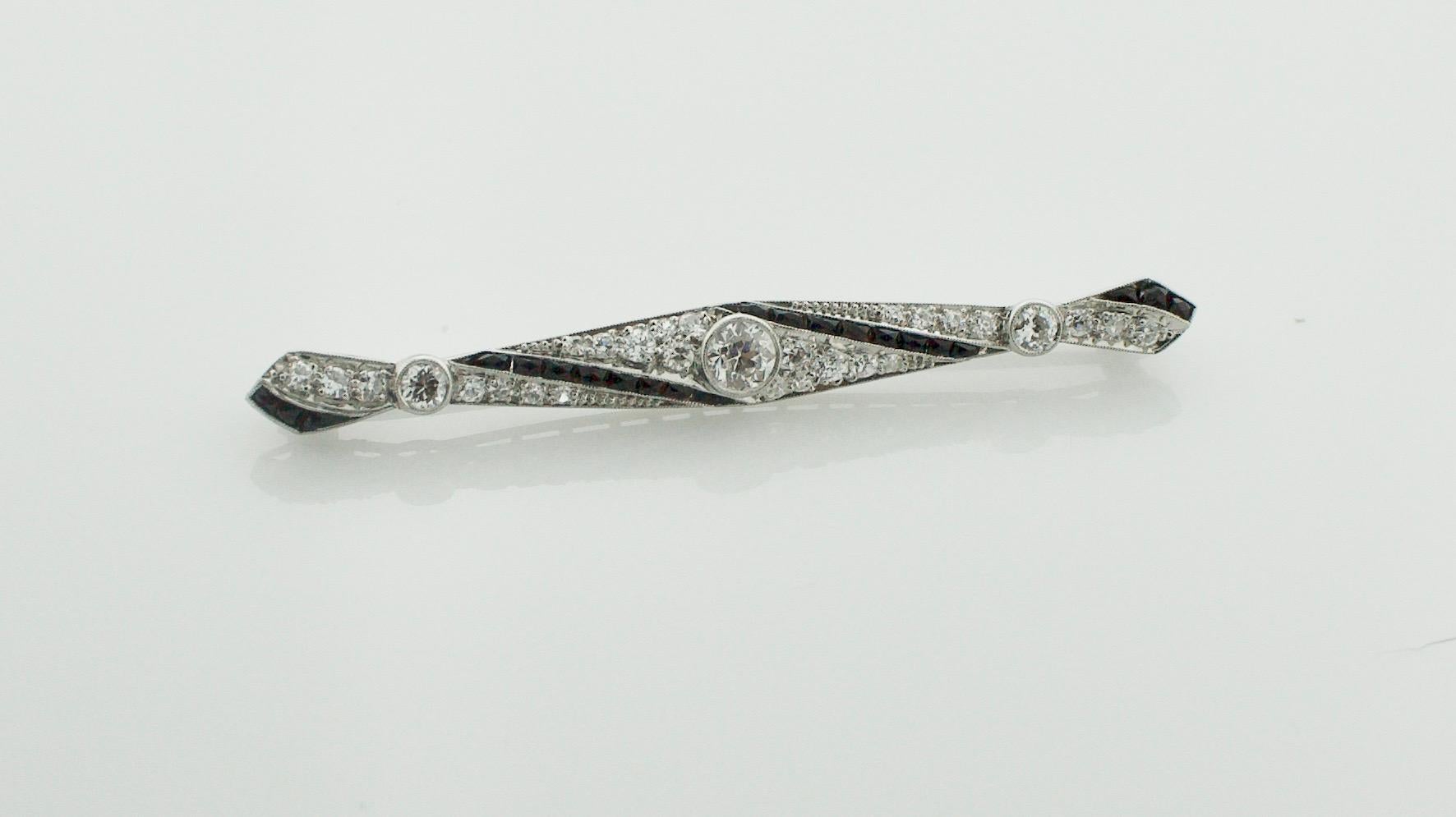 Old European Cut Extreme Art Deco Diamond and French Cut Onyx Brooch, circa 1920s in Platinum For Sale