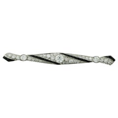 Extreme Art Deco Diamond and French Cut Onyx Brooch, circa 1920s in Platinum