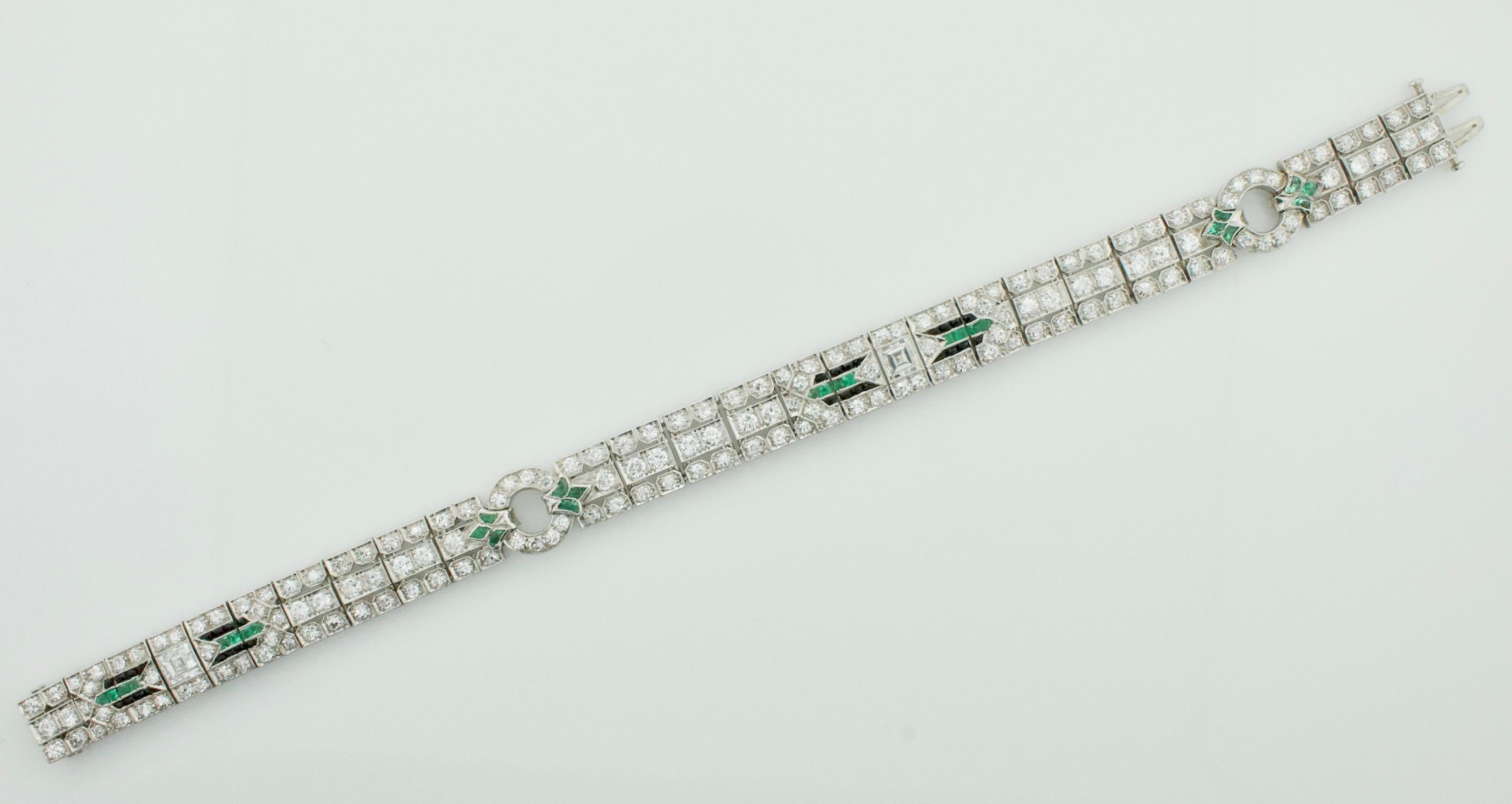 Extreme Art Deco Diamond, Emerald and Onyx Platinum Bracelet 
Looking for a statement piece that exudes the glamour and sophistication of the Art Deco era? Look no further than our Extreme Art Deco Diamond, Emerald and Onyx Platinum Bracelet, Circa