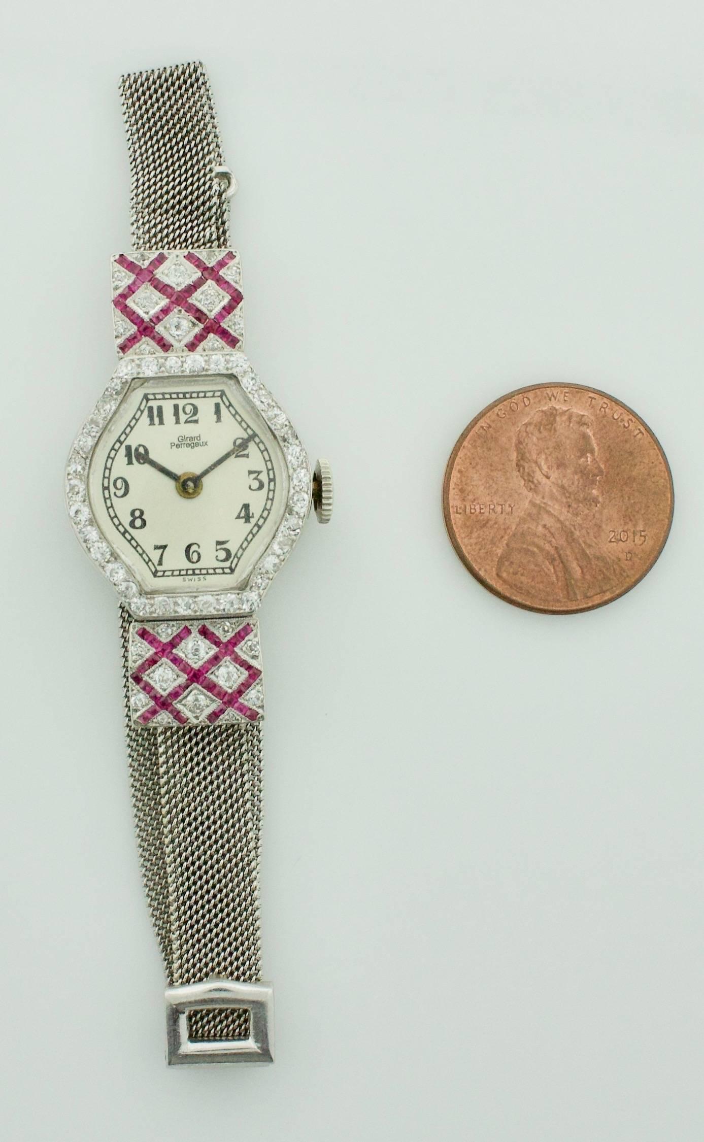 Extreme Art Deco Ruby and Diamond Circa 1920's Lady's Watch Girard Perregaux
Seventy Six Calibrated French-Cut Rubies Set in a Criss-Cross Pattern weighing ..80 carats approximatley 
Fifty Six Round Diamonds weighing .65 carats approximatley 
The
