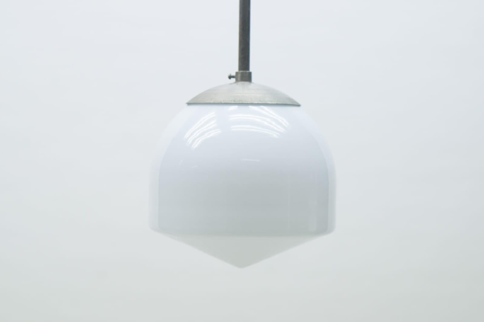 Extremely Rare Art Deco Lamp In the Style of Marianne Brandt, 1930s Germany

Probaly Kandem.

A wonderfully simple ceiling lamp. The typical minimalism of the Bauhaus school. 

The lamp is executed with 1x E27 Edison screw fit bulb. It is wired and