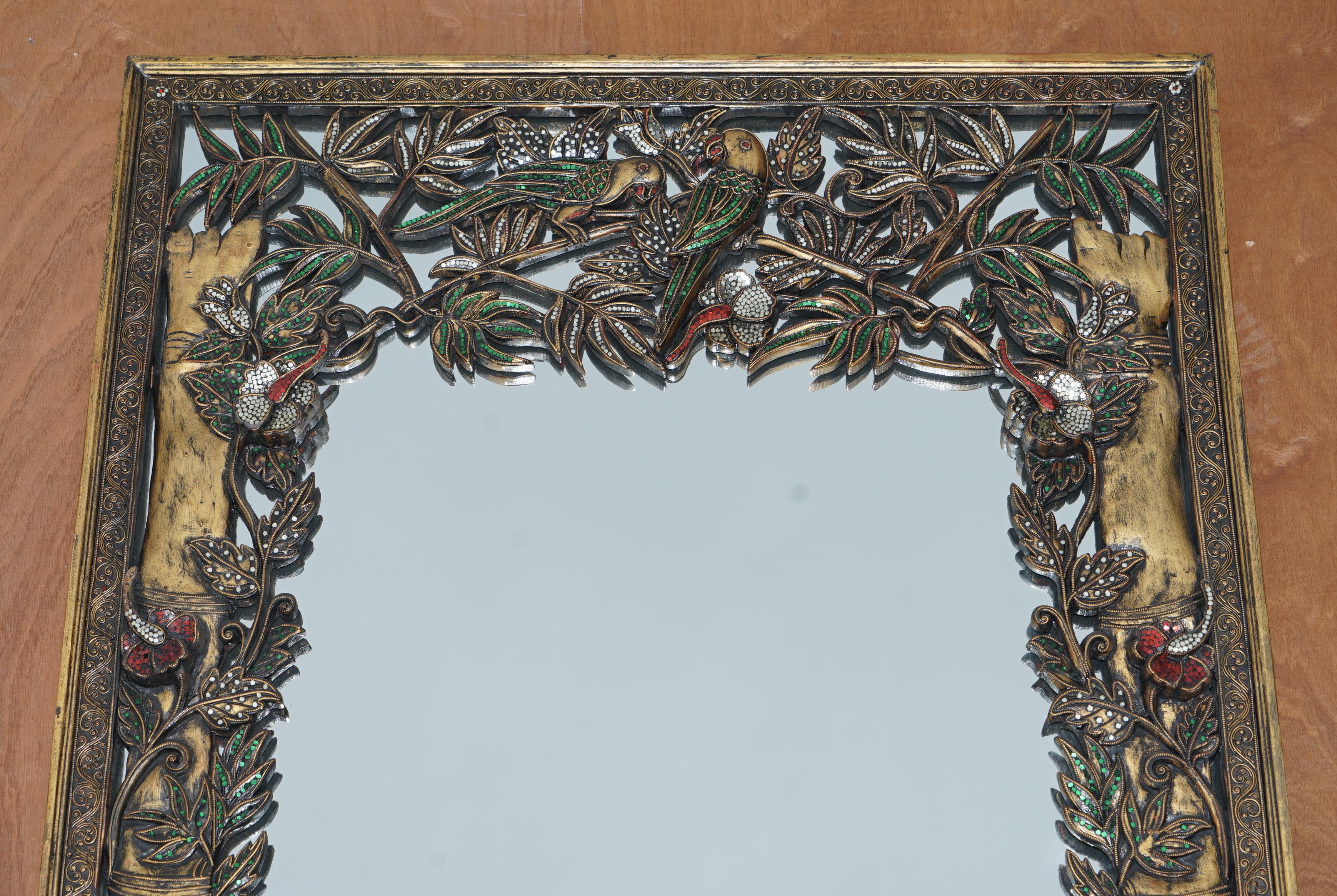 mirror with birds on frame