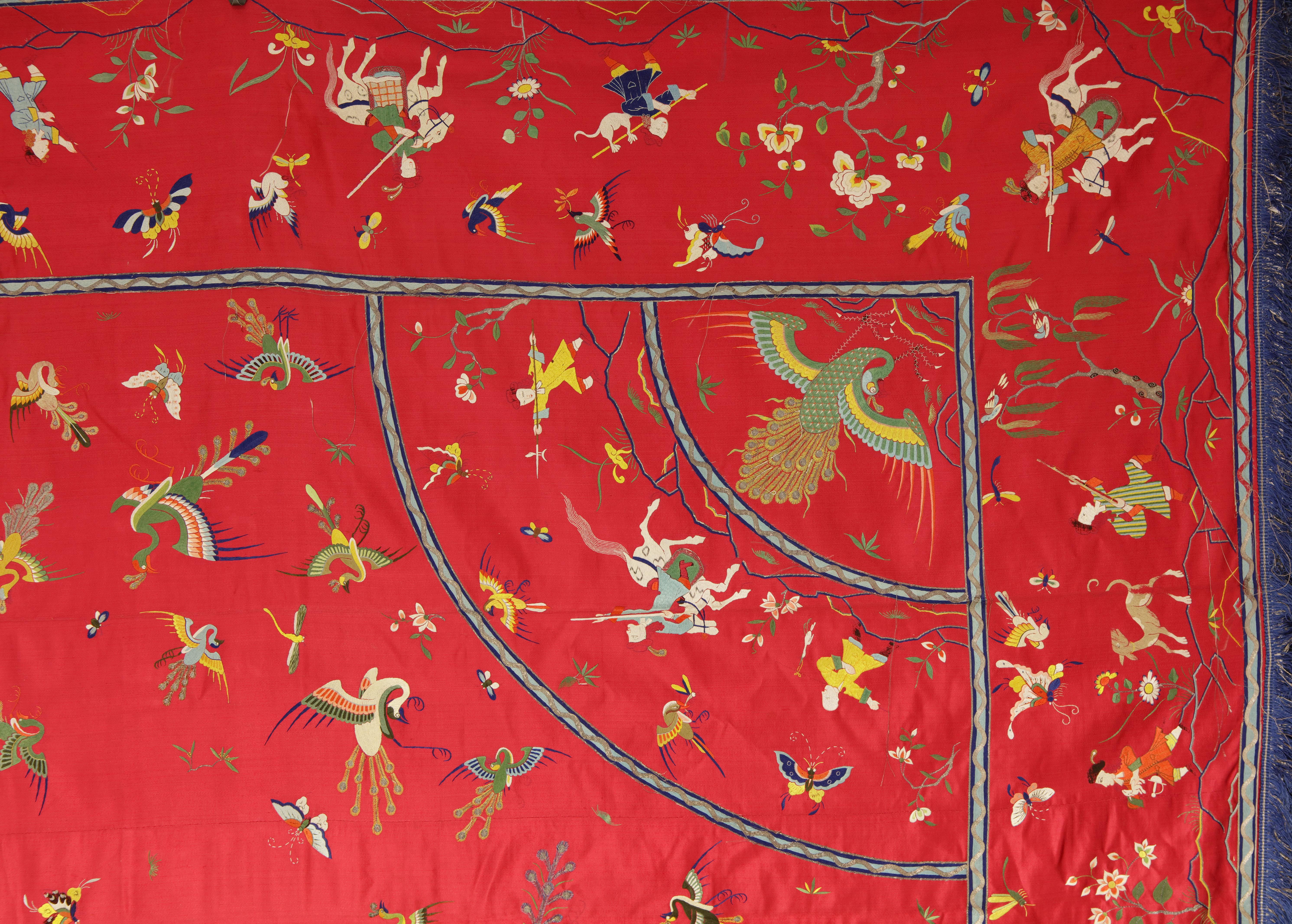 A Chinese red silk, embroidered bed cover

Guangdong or Macao, mid-18th century

The red silk cover, one one side elaborately embroided in coloured silk and gilt-paper-wrapped thread, with a central medaillion with Phoenix, surrounded by various