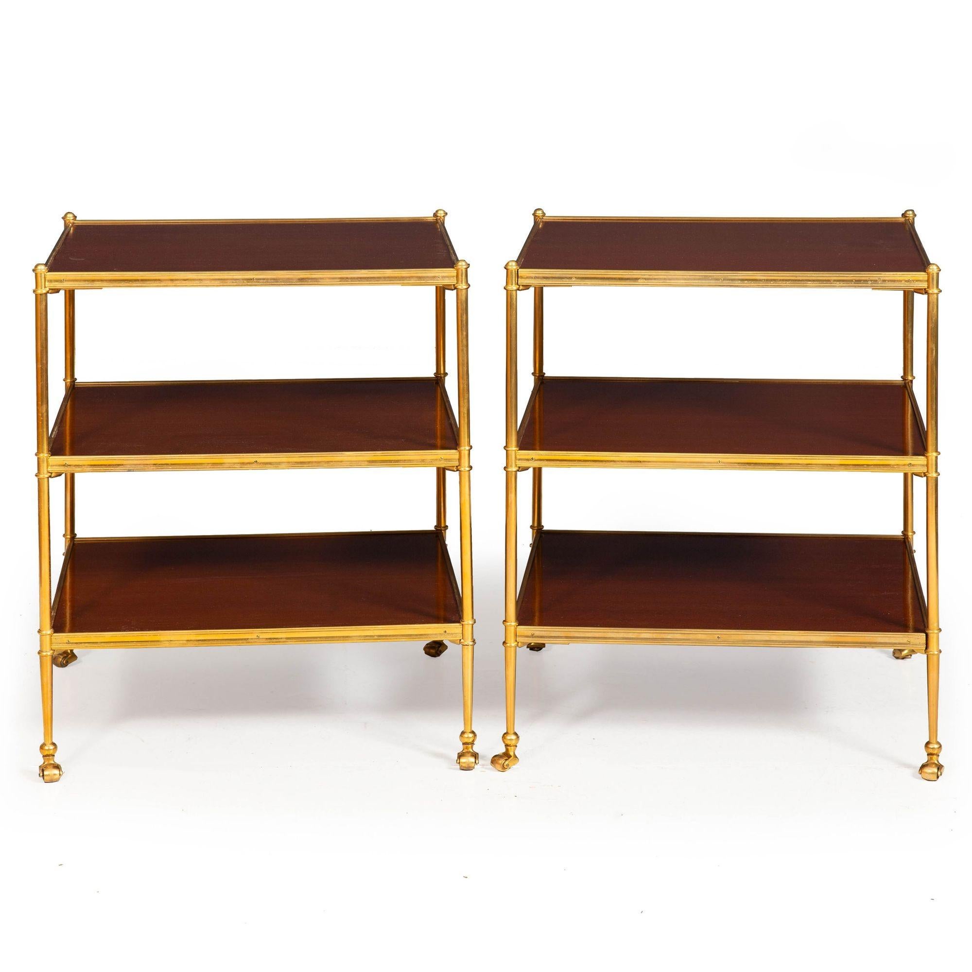 A VERY FINE PAIR OF REGENCY STYLE GILT-BRONZE AND MAHOGANY THREE-TIER ETAGERES
In the manner of Maison Jansen  unmarked  ca. mid 20th century
Item # 312XJH07E

An exceedingly fine pair of three-tier end tables from the second half of the 20th