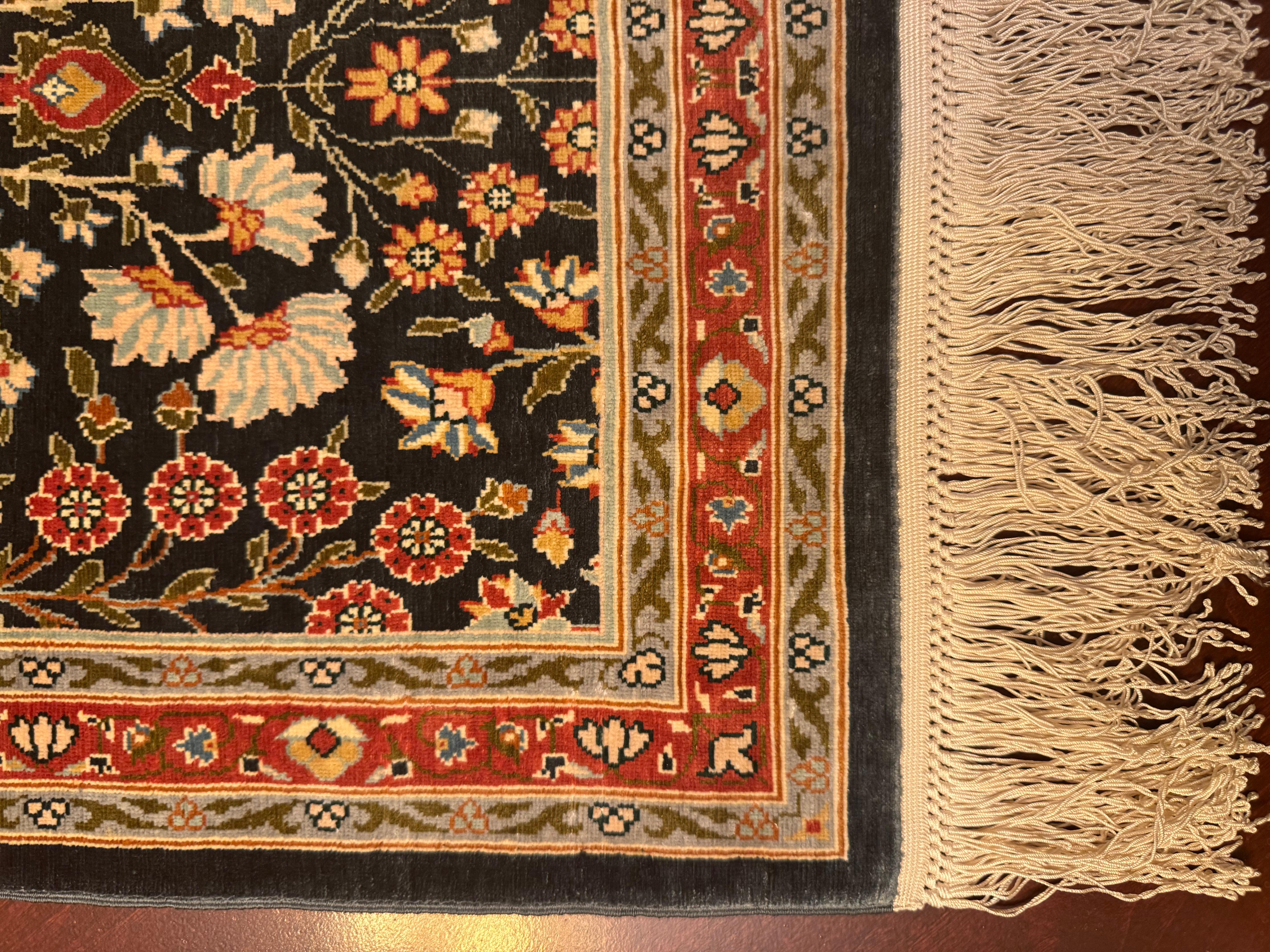 An exquisite, 100% silk Turkish Hereke rug, meticulously handcrafted in Turkey during the 1990s. This remarkable piece epitomizes timeless elegance and superior craftsmanship, boasting an unparalleled level of quality. Preserved in impeccable