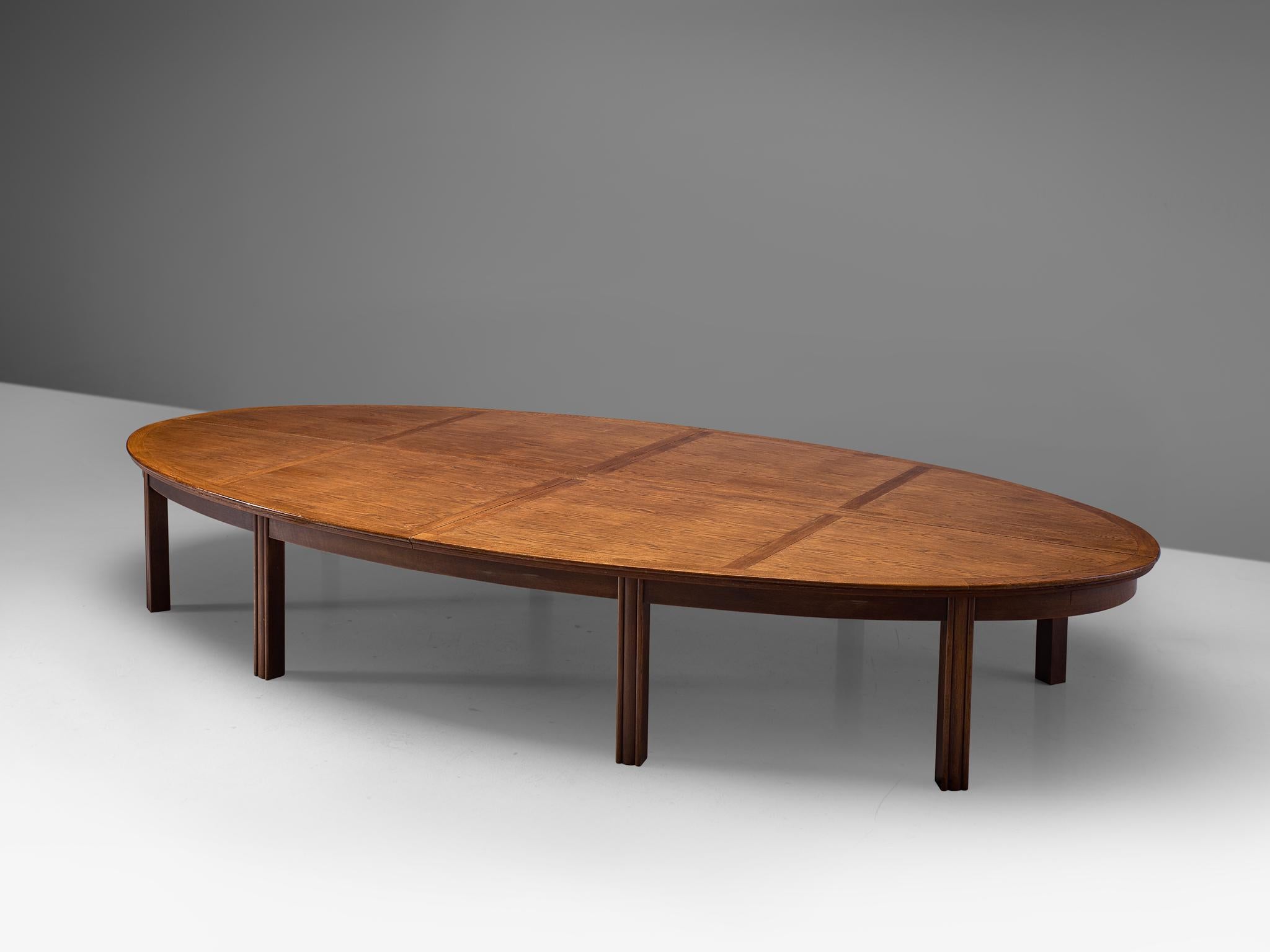 Conference table, oak, the Netherlands, 1950s.

Beautiful aged large conference or dining table in Art Deco style. The oval shaped tabletop has a width of 5mtr/39.4in and rests on eight straight, robust legs. The characteristic grain and pattern