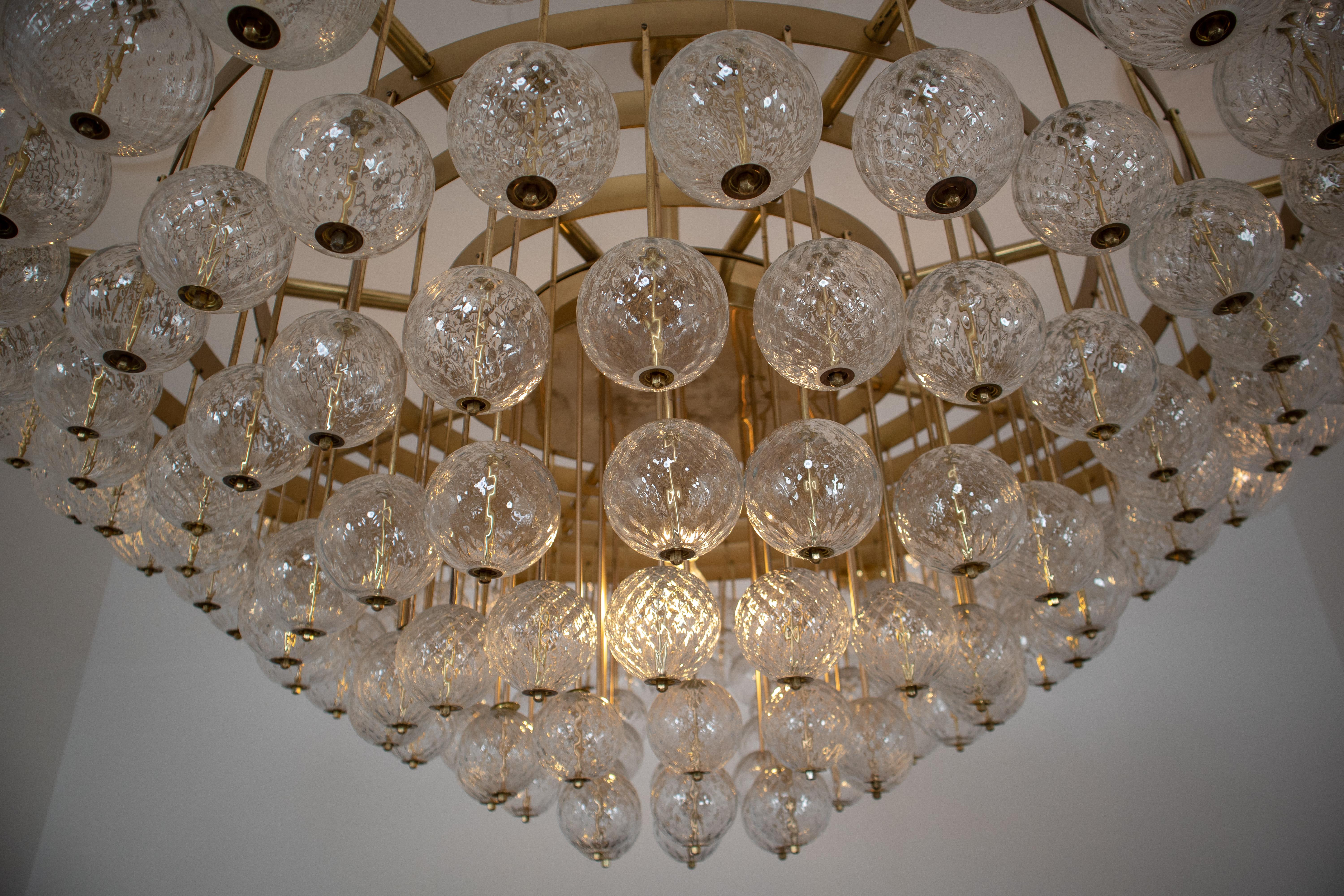 Extremely Large Hotel Chandelier with Brass Fixture and Structured Glass Globes 4